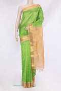 Parrot Green Silk Cotton Saree with Zari Butta on the body and Zari Border.  displayed on a mannequin