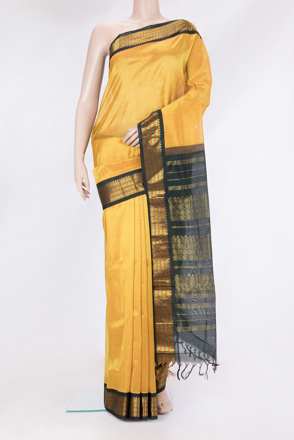 Yellow Silk Cotton Saree with Stripes on the body and Zari Border.  displayed on a mannequin