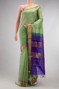 Pista Green Dual Tone Silk Cotton Saree with Checked design on the body and Zari Border.  displayed on a mannequin