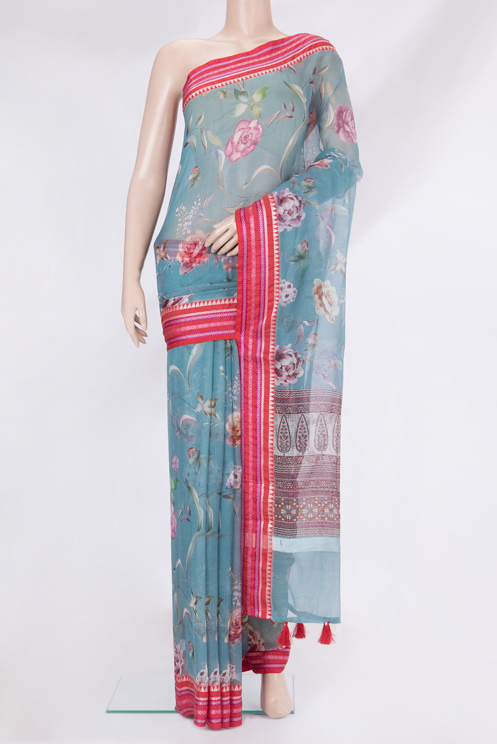 Blue Kota Silk Saree with Printed design on the body and Thread Border.  displayed on a mannequin