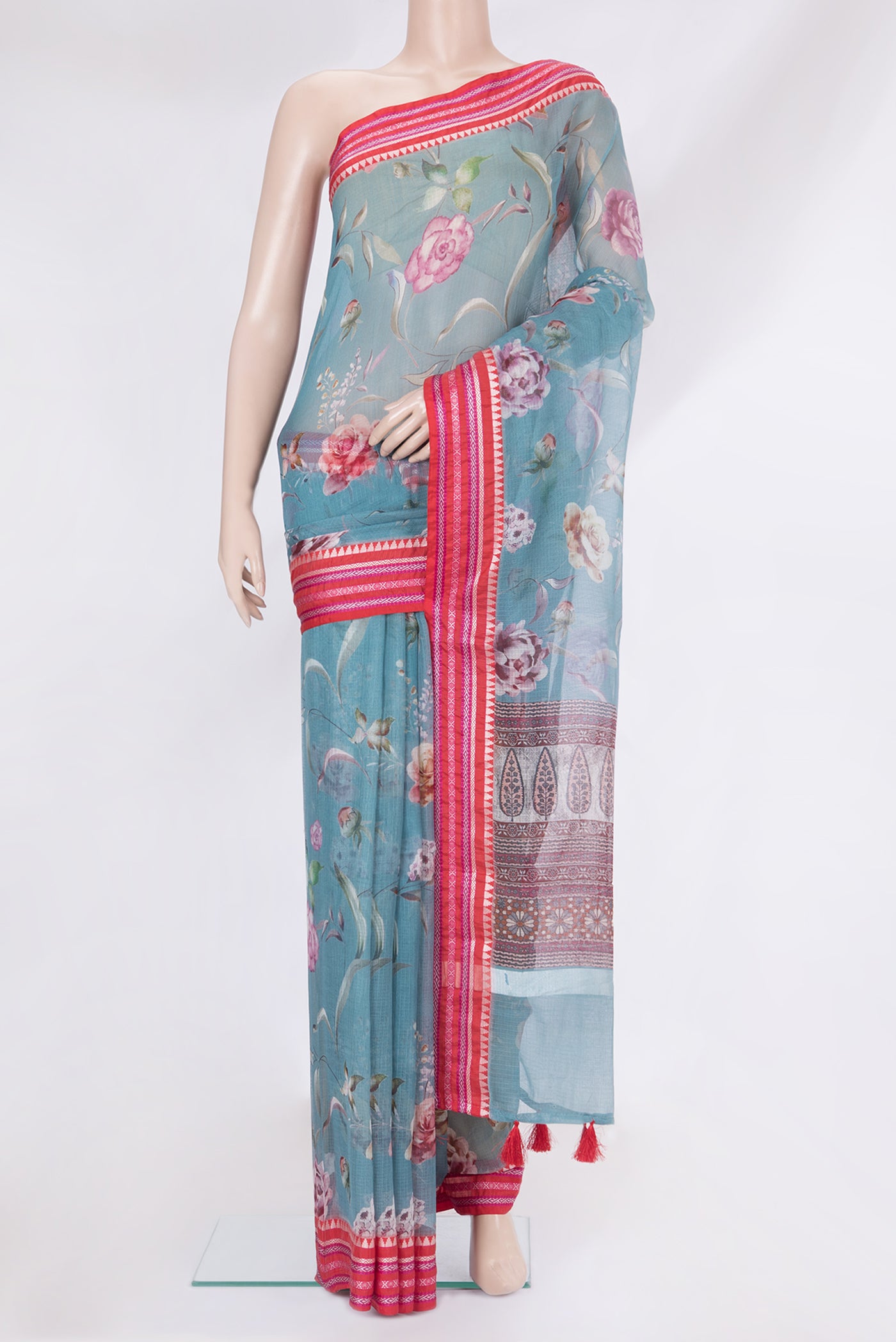 Blue Kota Silk Saree with Printed design on the body and Thread Border.  displayed on a mannequin