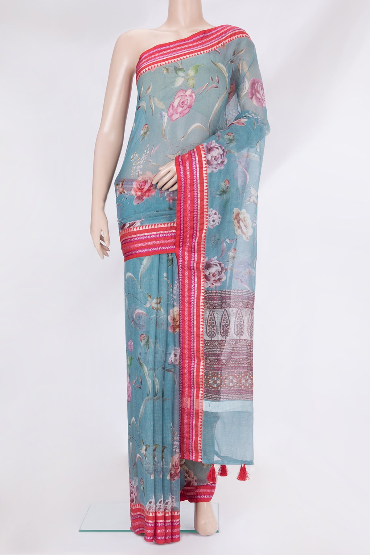 Blue Kota Silk Saree with Printed design on the body and Thread Border.  displayed on a mannequin