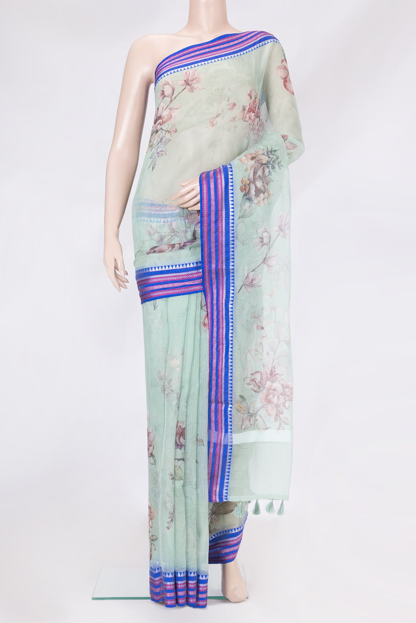 Light Green Kota Silk Saree with Printed design on the body and Thread Border.  displayed on a mannequin