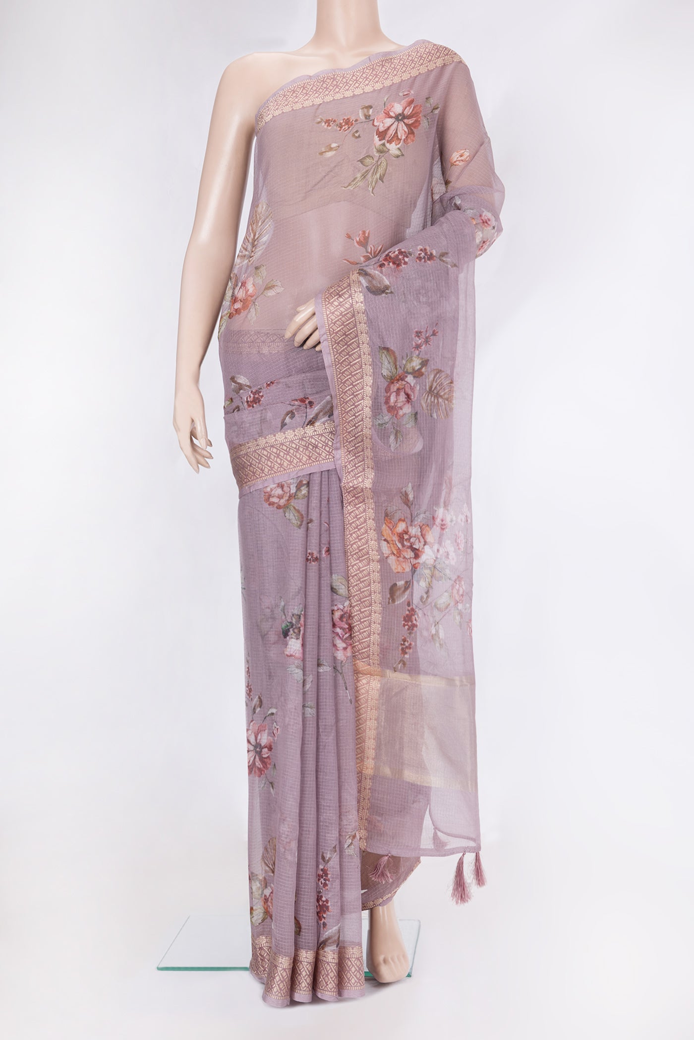 Lavender Kota Silk Saree with Printed design on the body and Zari Border.  displayed on a mannequin