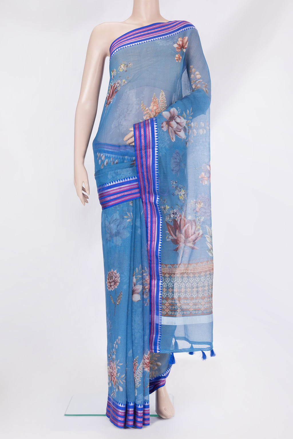 Blue Kota Silk Saree with Floral Print on the body and Thread Border.  displayed on a mannequin