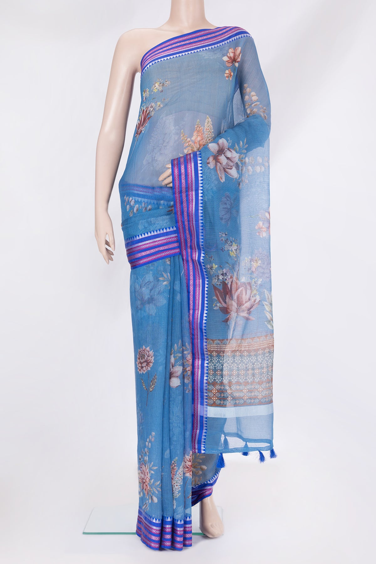 Blue Kota Silk Saree with Floral Print on the body and Thread Border.  displayed on a mannequin