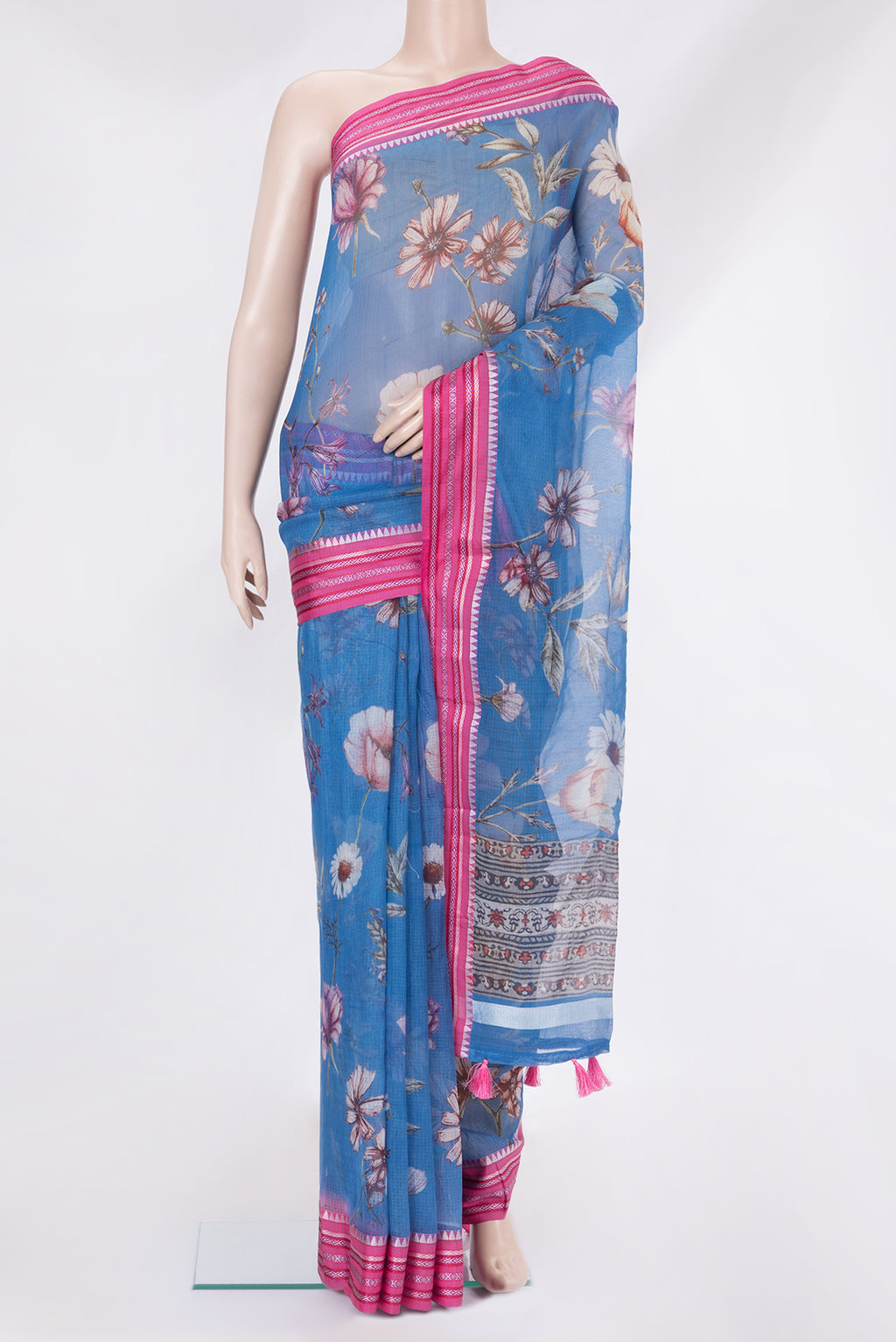 Blue Kota Silk Saree with Floral Print on the body and Thread Border.  displayed on a mannequin