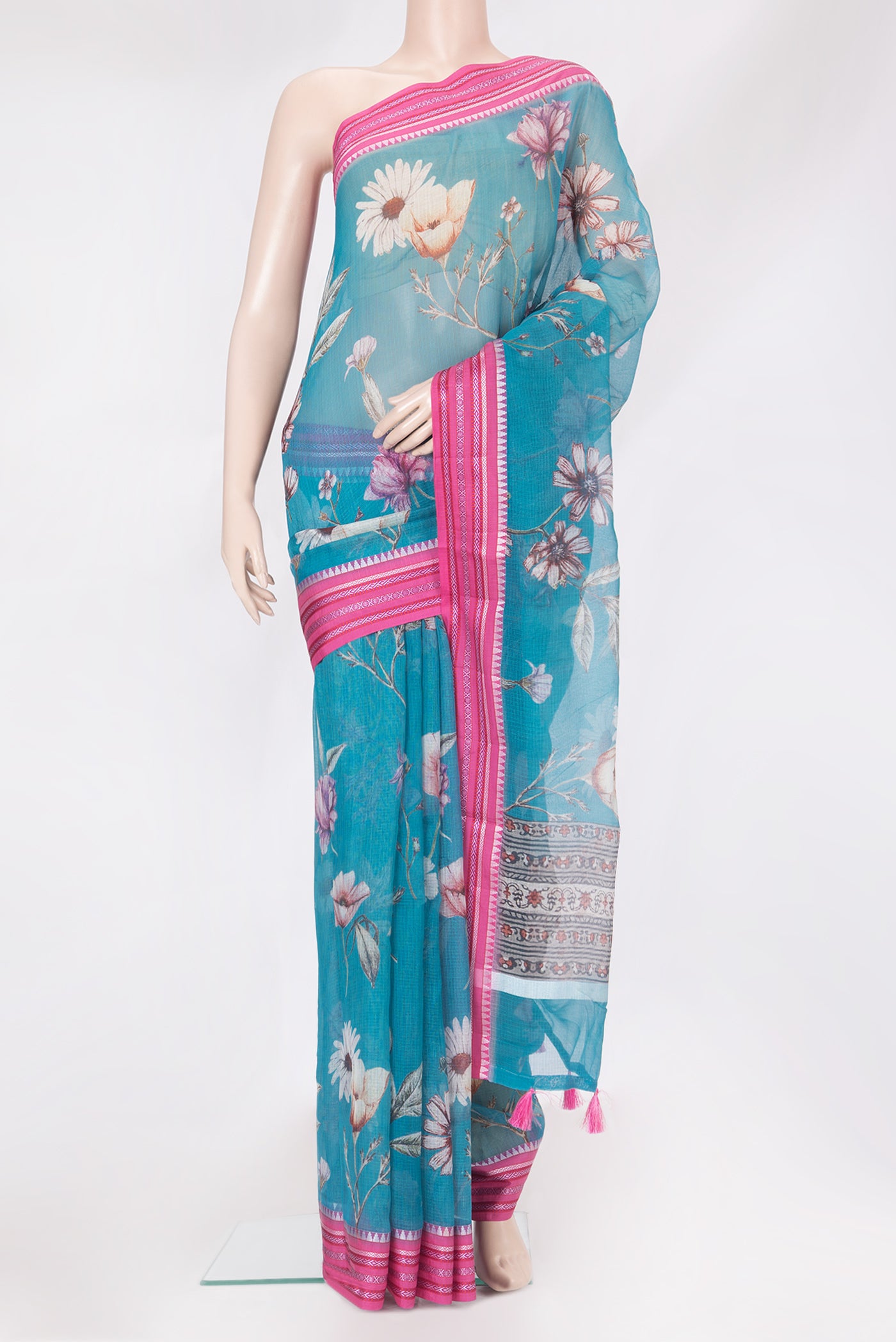 Sky Blue Kota Silk Saree with Floral Print on the body and Thread Border.  displayed on a mannequin