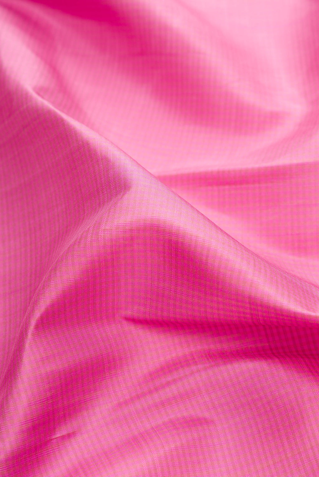 Close up of Pure Silk Pure Zari Pink Dual Tone Kanjivaram Saree with Stripes on the body and Zari Border.  displaying folds