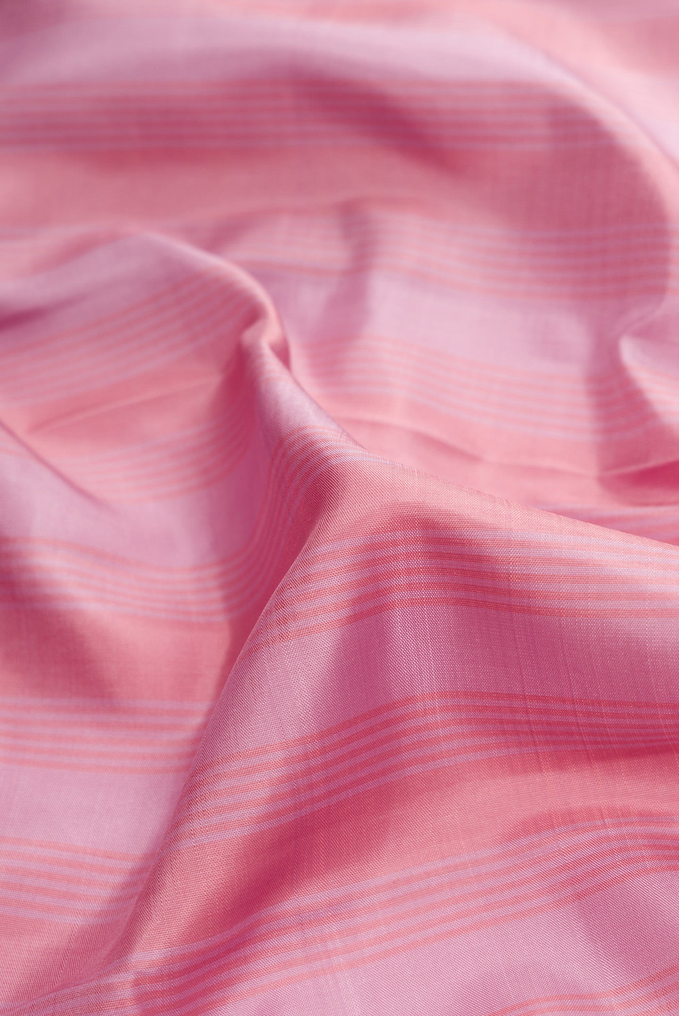Close up of Pure Silk Pure Zari Lavender Dual Tone Kanjivaram Saree with Stripes on the body and Zari Border.  displaying folds