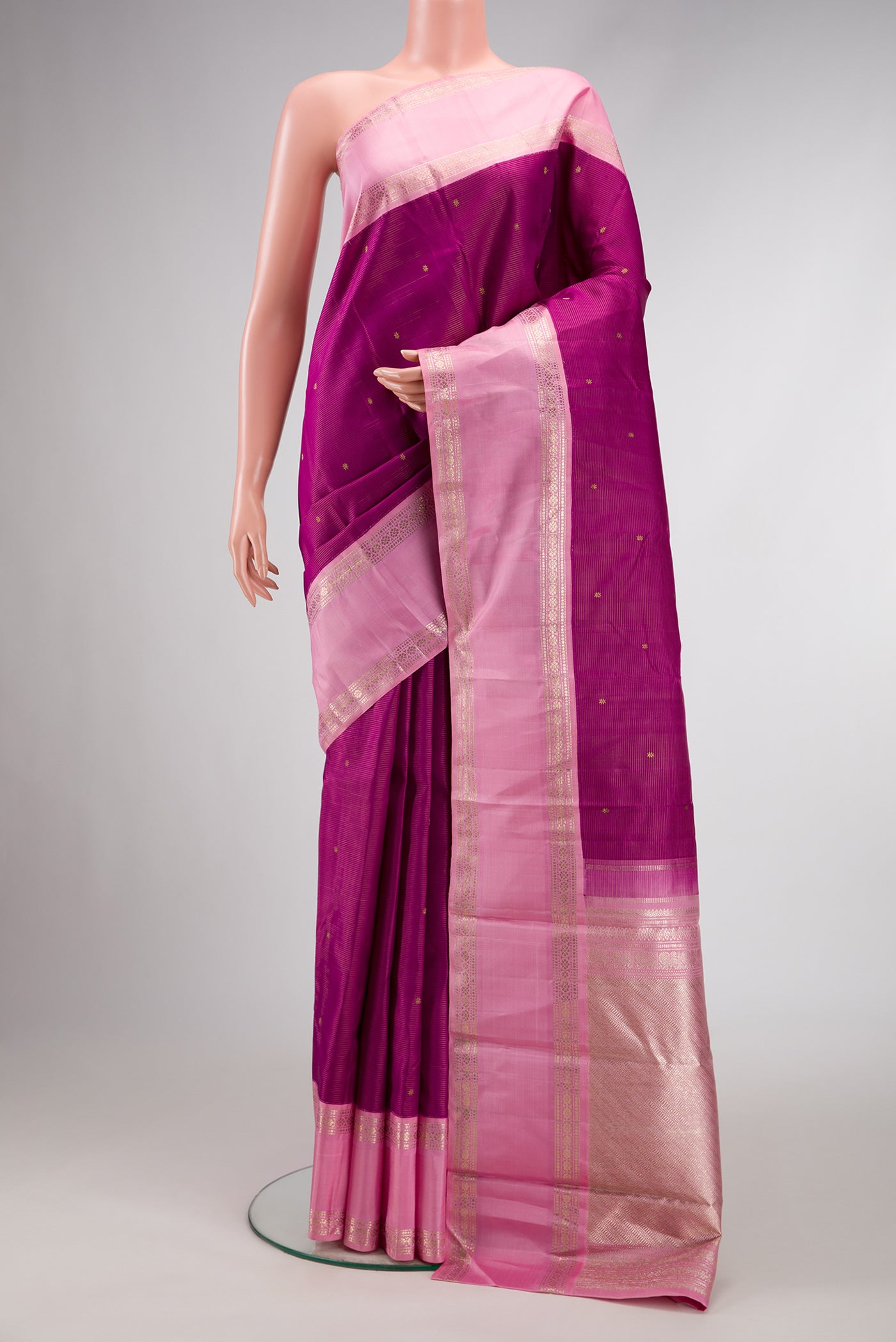 Pure Silk Pure Zari Purple Dual Tone Kanchipuram Saree with Zari Butta on the body and Zari And Thread Border.  displayed on a mannequin