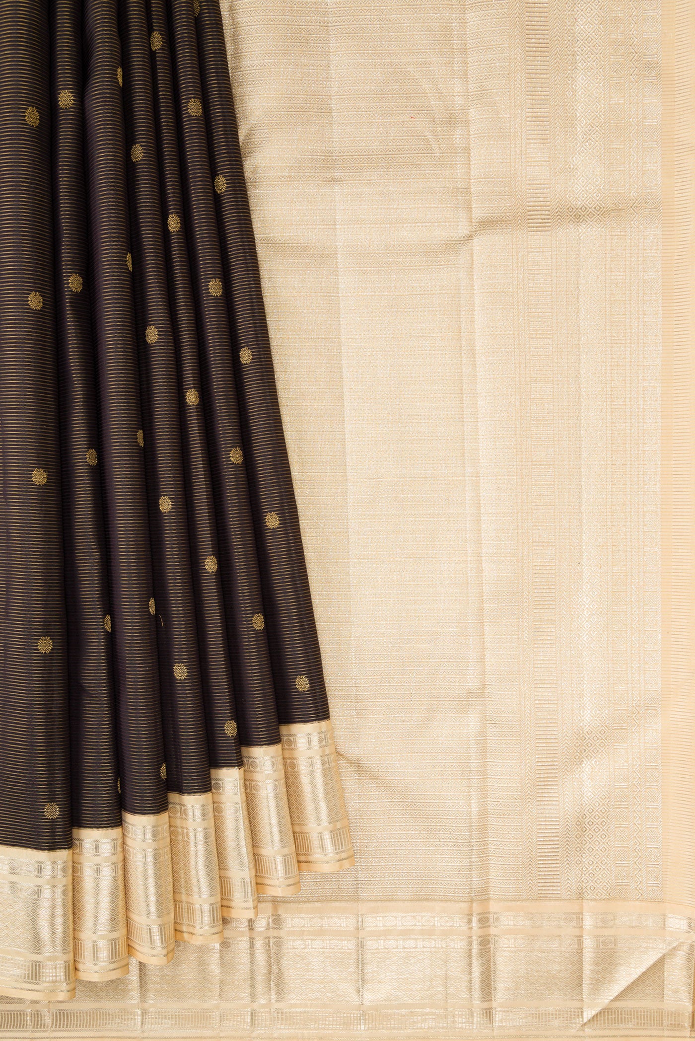 Pleats and pallu of Black Dual Tone Kanchipuram Silk Saree with Stripes on the body and Zari Border. 