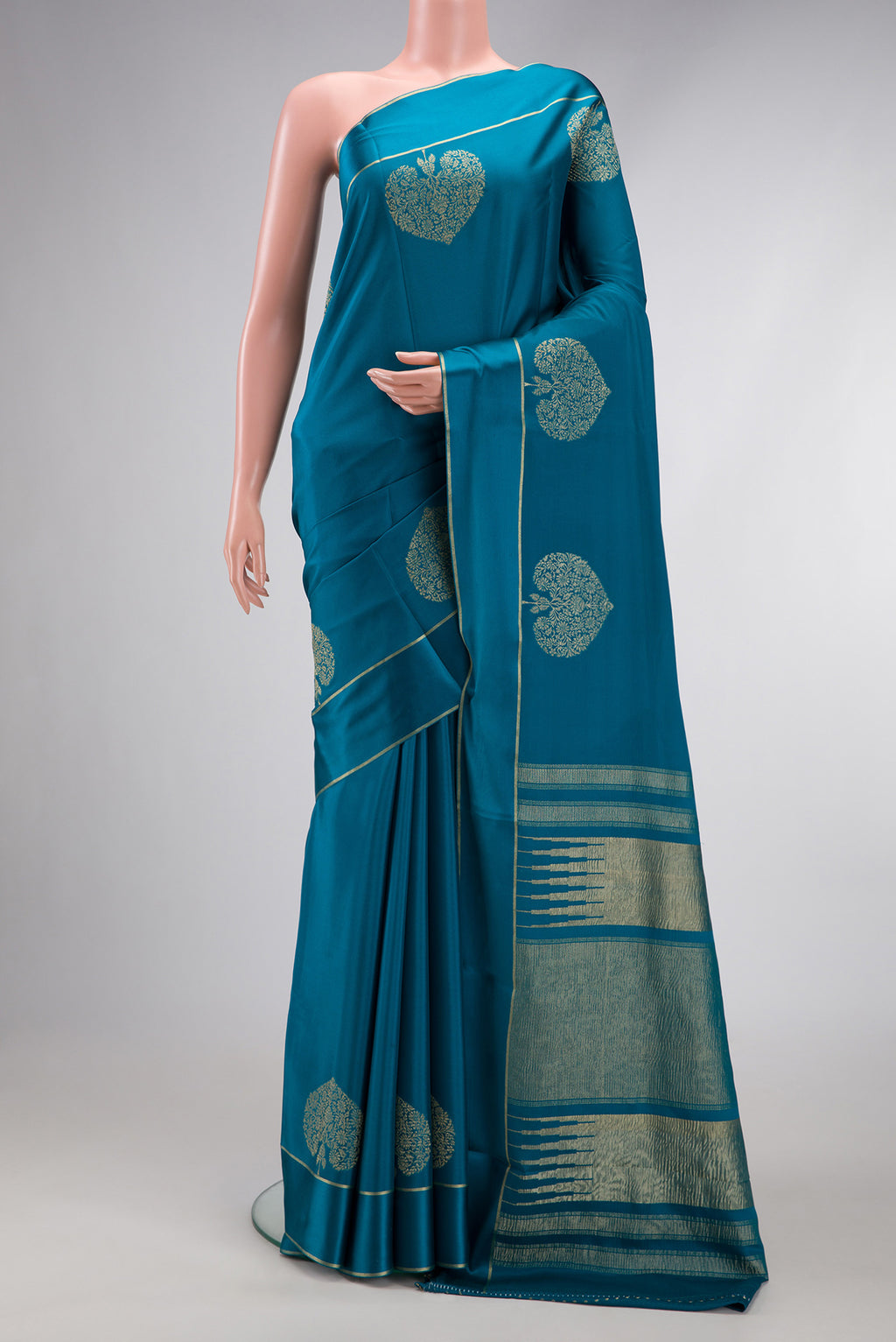 Peacock Blue Dual Tone Mysore Crepe Saree with Plain Body and Fancy Border.  displayed on a mannequin