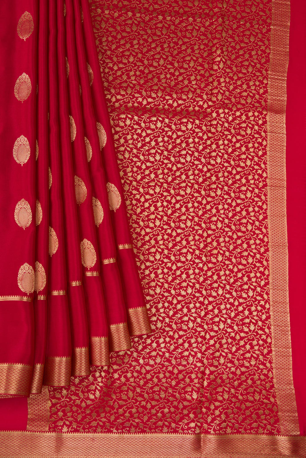Pleats and pallu of Red Mysore Crepe Saree with Zari Butta on the body and Zari Border. 