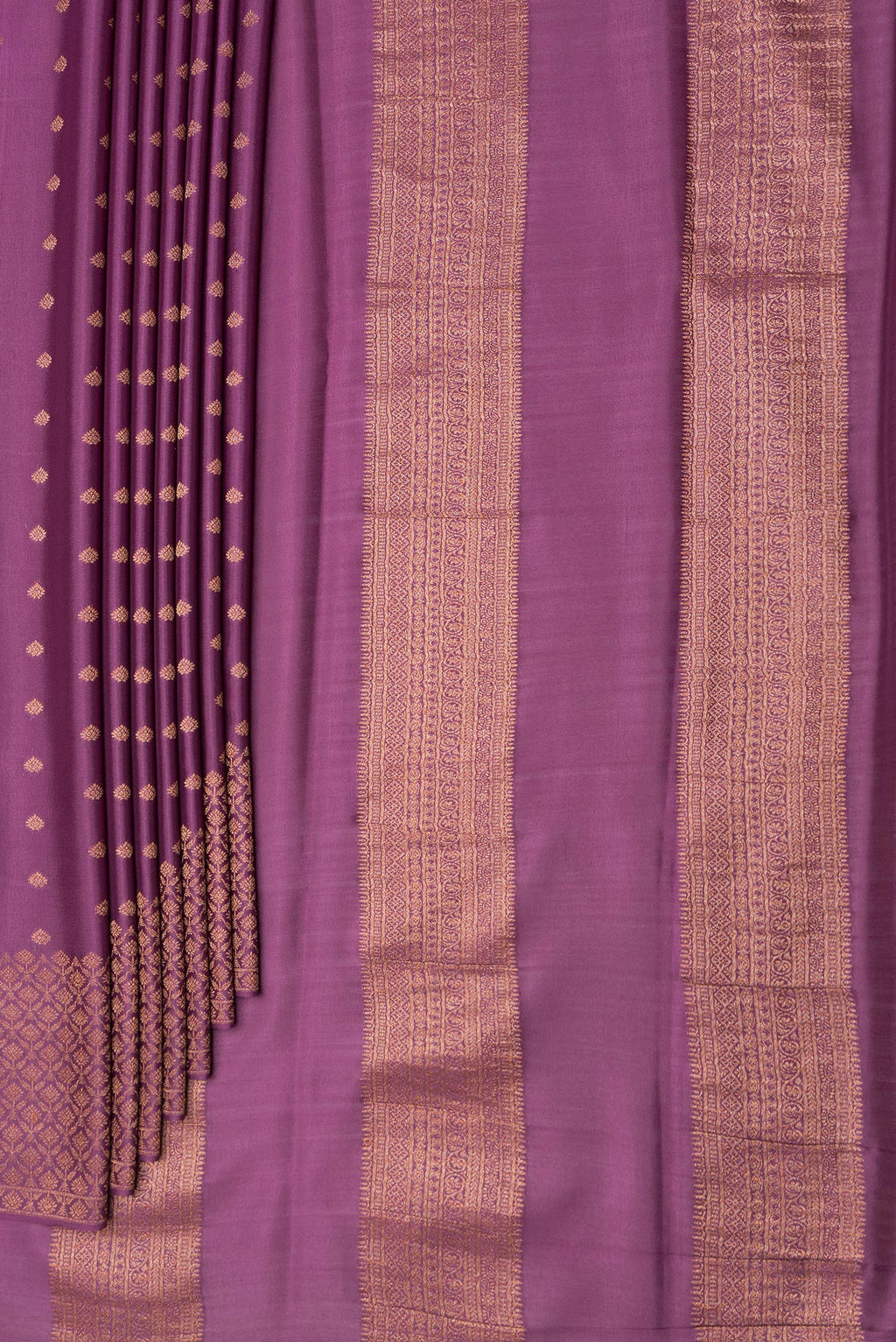 Pleats and pallu of Purple Dual Tone Mysore Crepe Saree with Zari Butta on the body and Zari Border. 