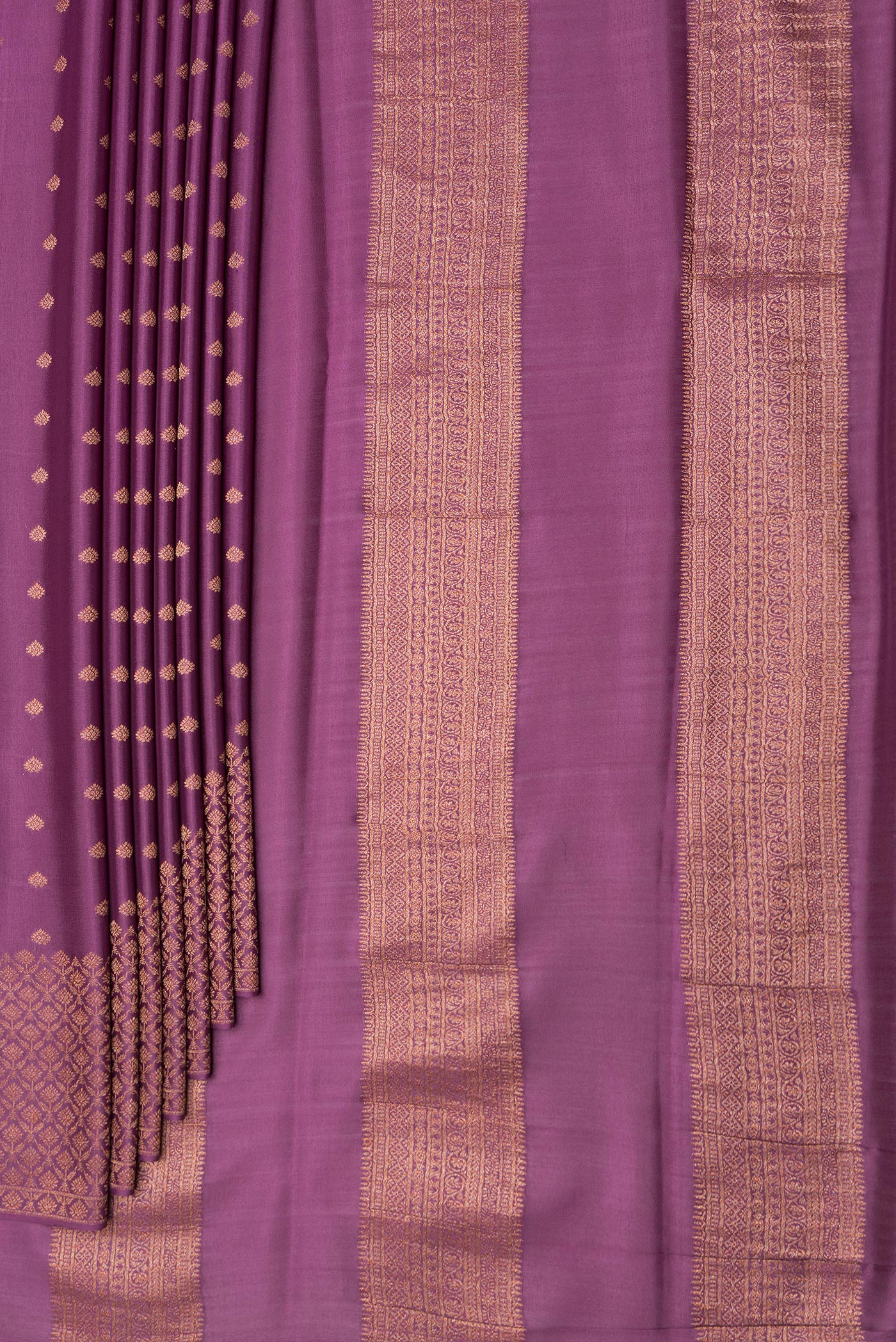 Pleats and pallu of Purple Dual Tone Mysore Crepe Saree with Zari Butta on the body and Zari Border. 