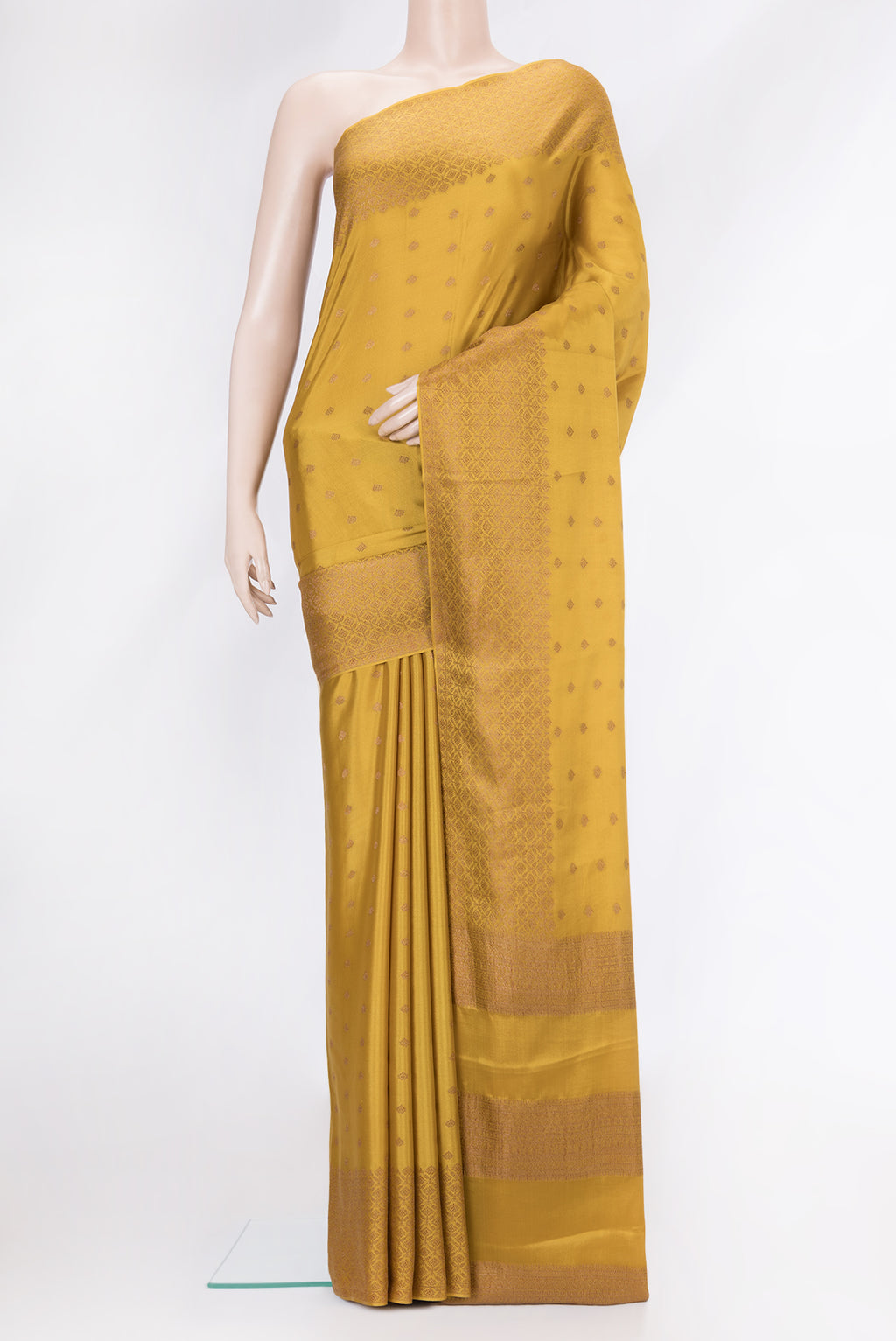 Mustard Dual Tone Mysore Crepe Saree with Zari Butta on the body and Zari Border.  displayed on a mannequin