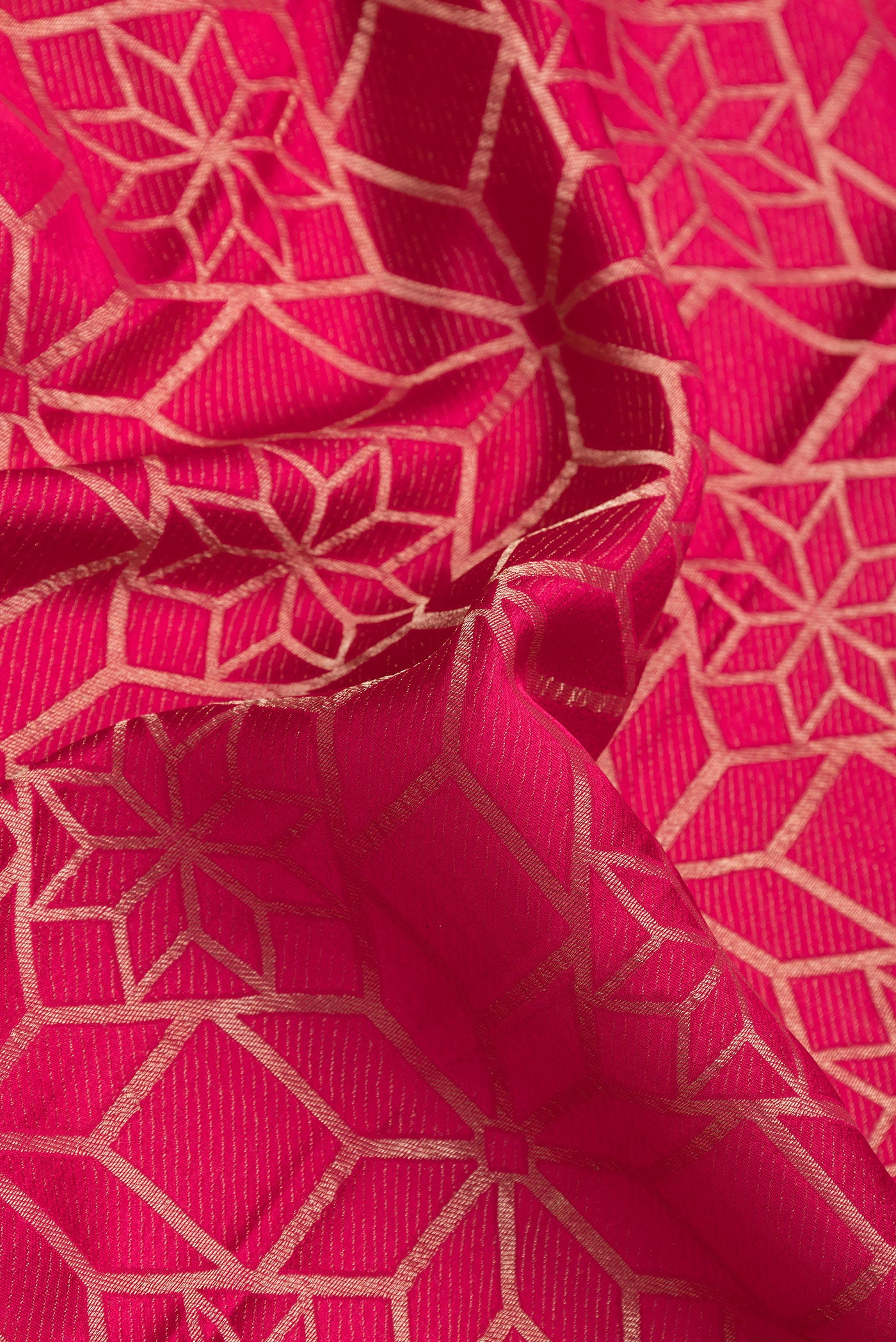 Close up of Pink Dual Tone Mysore Crepe Saree with Zari Brocade on the body and Zari Border.  displaying folds