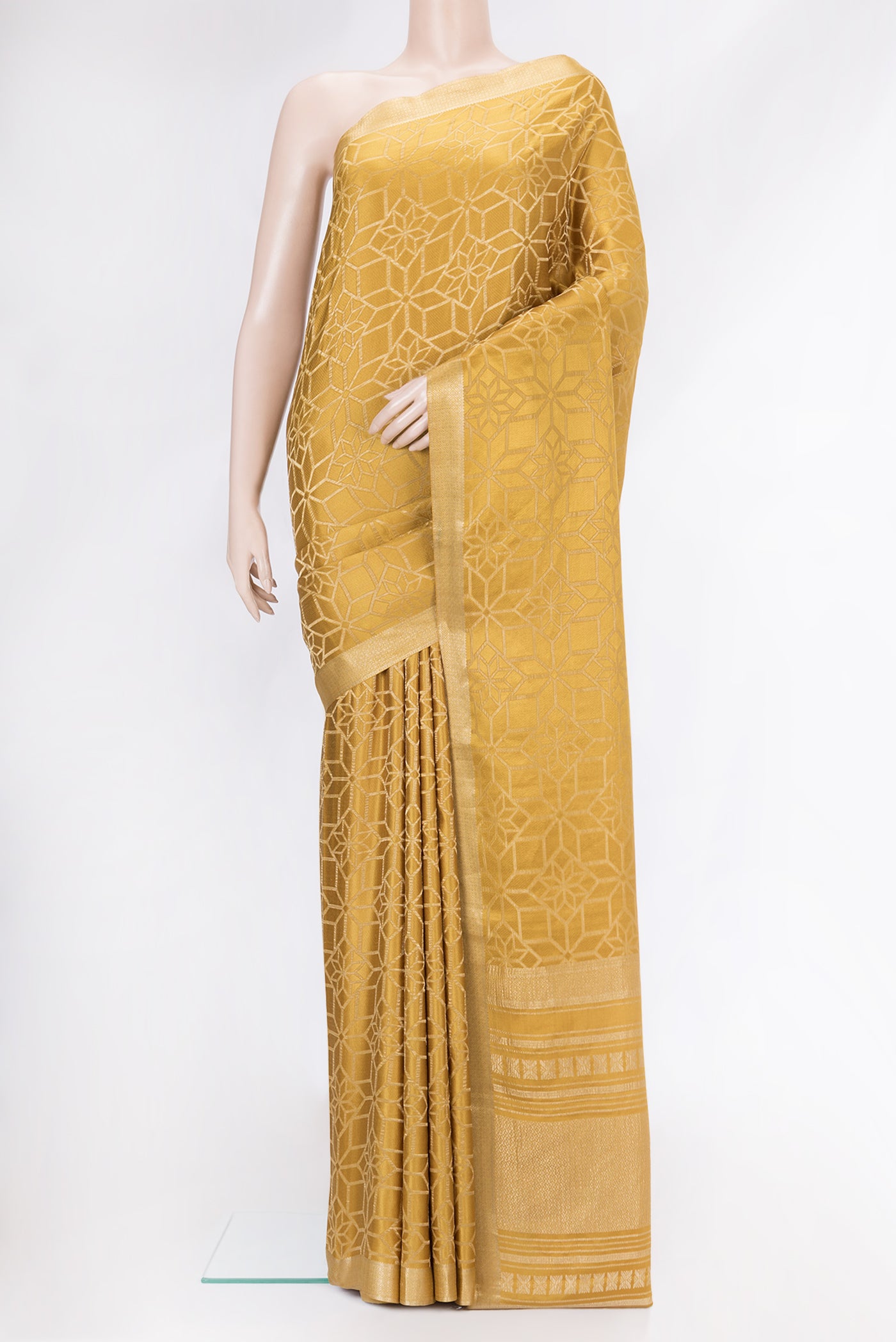 Gold Dual Tone Mysore Crepe Saree with Zari Brocade on the body and Zari Border.  displayed on a mannequin