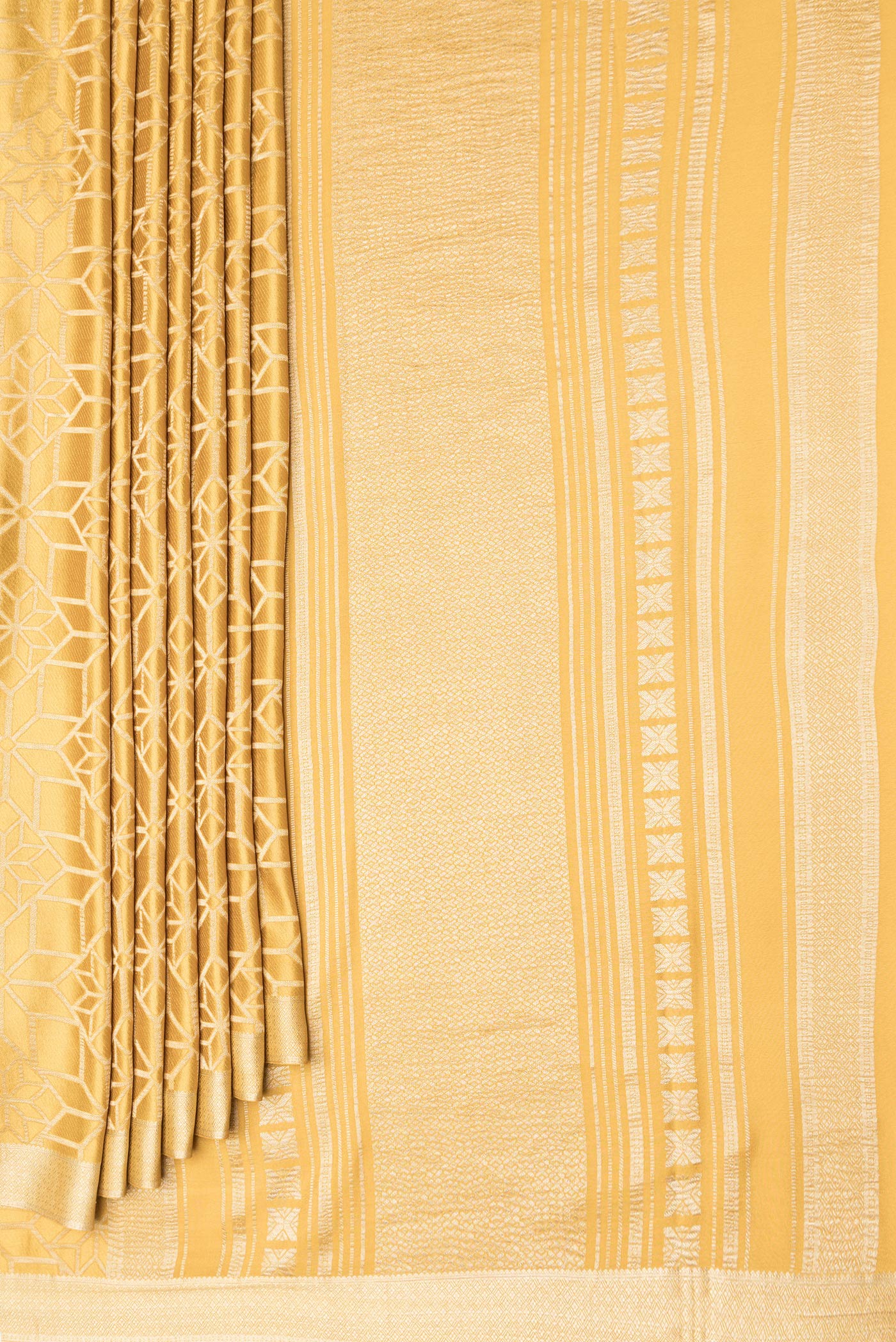 Pleats and pallu of Gold Dual Tone Mysore Crepe Saree with Zari Brocade on the body and Zari Border. 