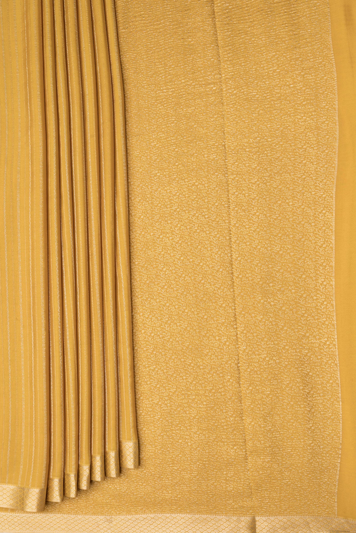 Pleats and pallu of Mustard Dual Tone Banarasi Georgette Saree with Stripes on the body and Zari Border. 