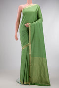 Pista Green Mysore Crepe Saree with Stripes on the body and Zari Border.  displayed on a mannequin