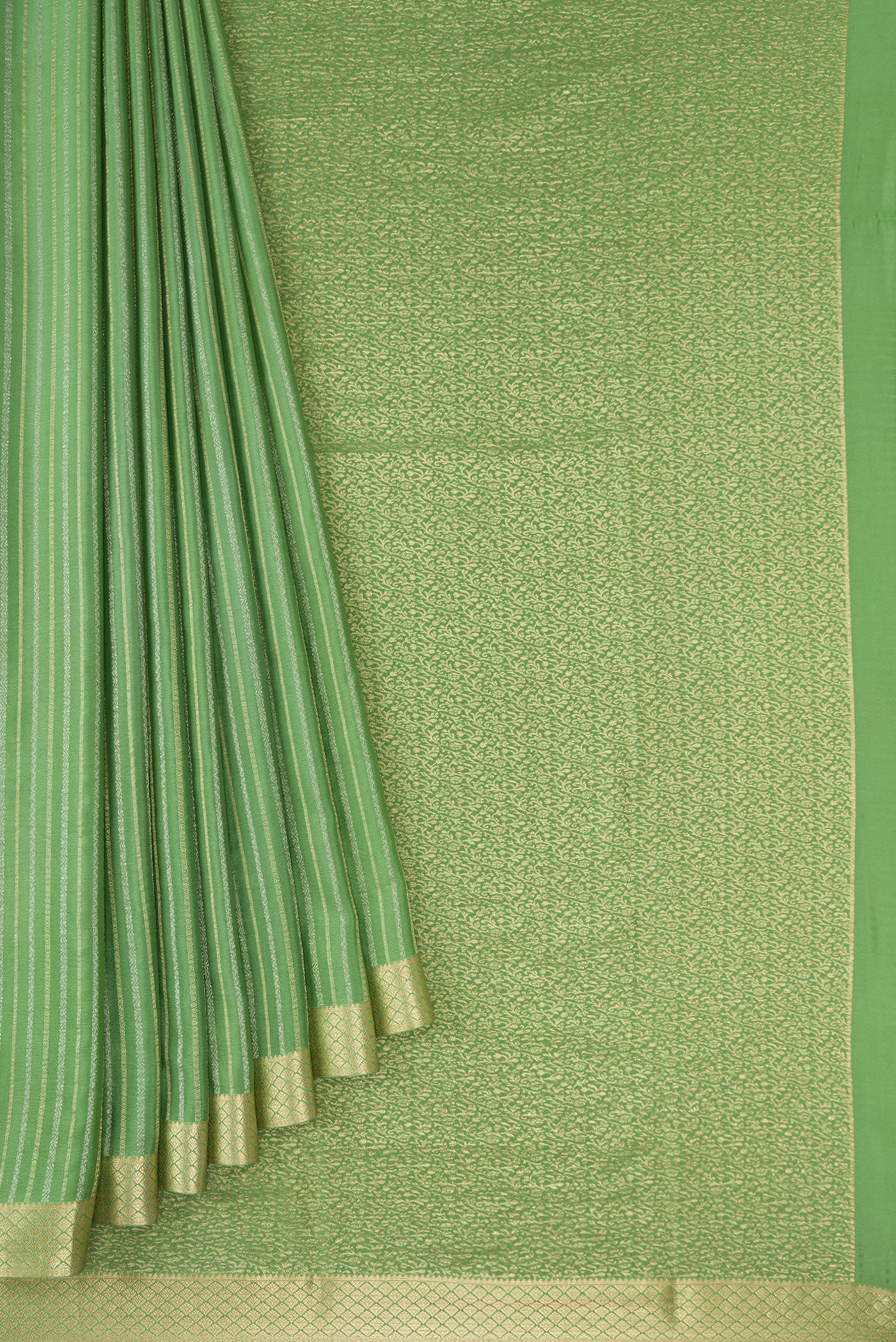 Pleats and pallu of Pista Green Mysore Crepe Saree with Stripes on the body and Zari Border. 