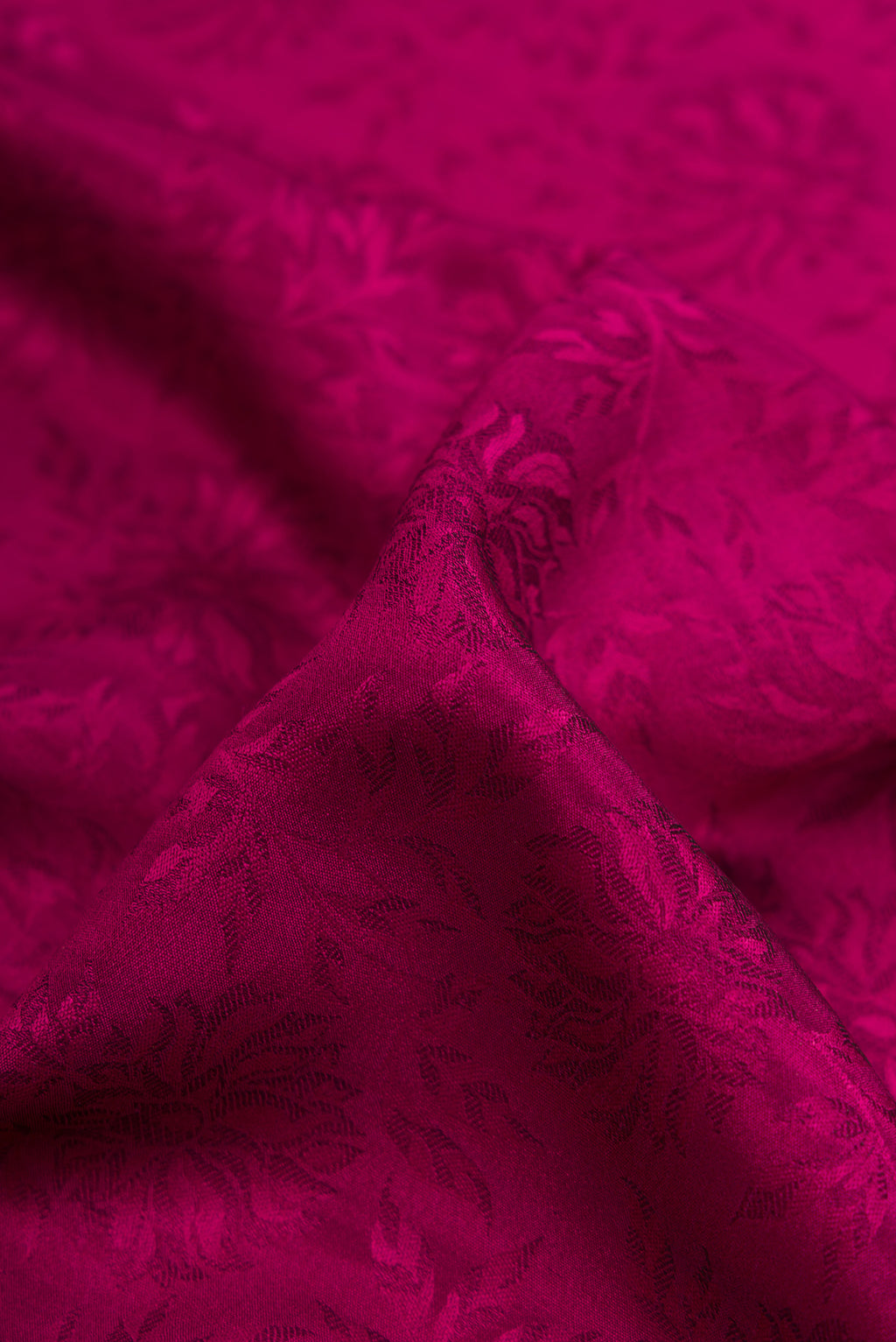 Close up of Purple Dual Tone Crepe Saree with Jacquard design on the body and Zari Border.  displaying folds