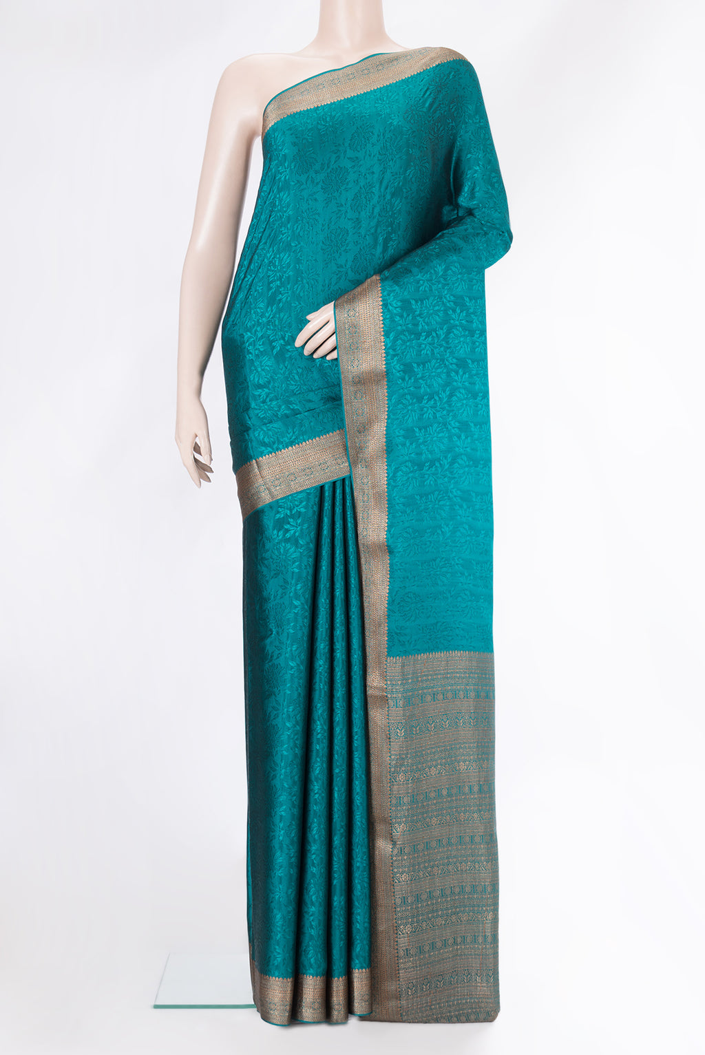 Peacock Blue Dual Tone Mysore Crepe Saree with Jacquard design on the body and Zari Border.  displayed on a mannequin