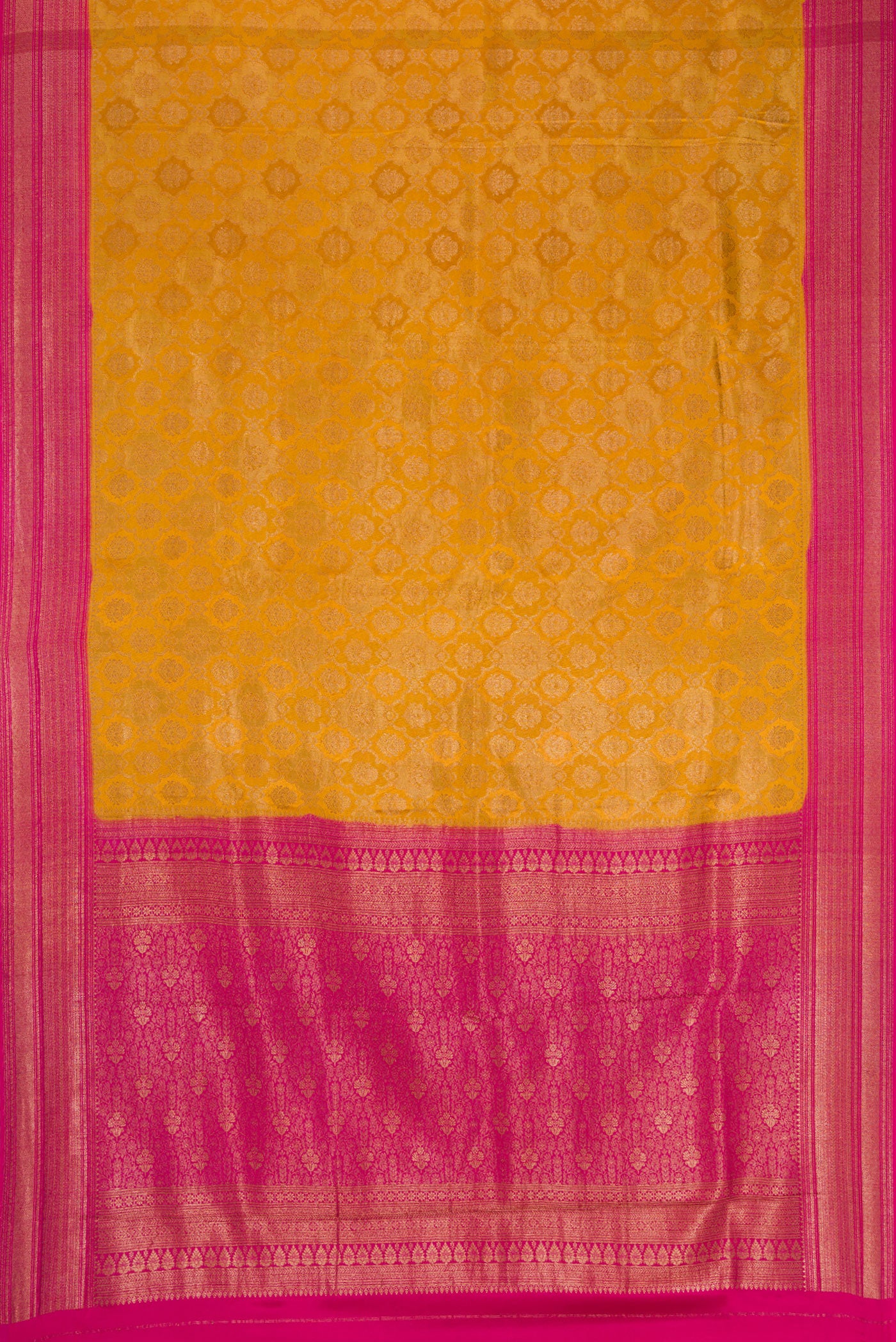 Flat view of Mustard Mysore Crepe Saree with Zari Brocade on the body and Zari Border. 