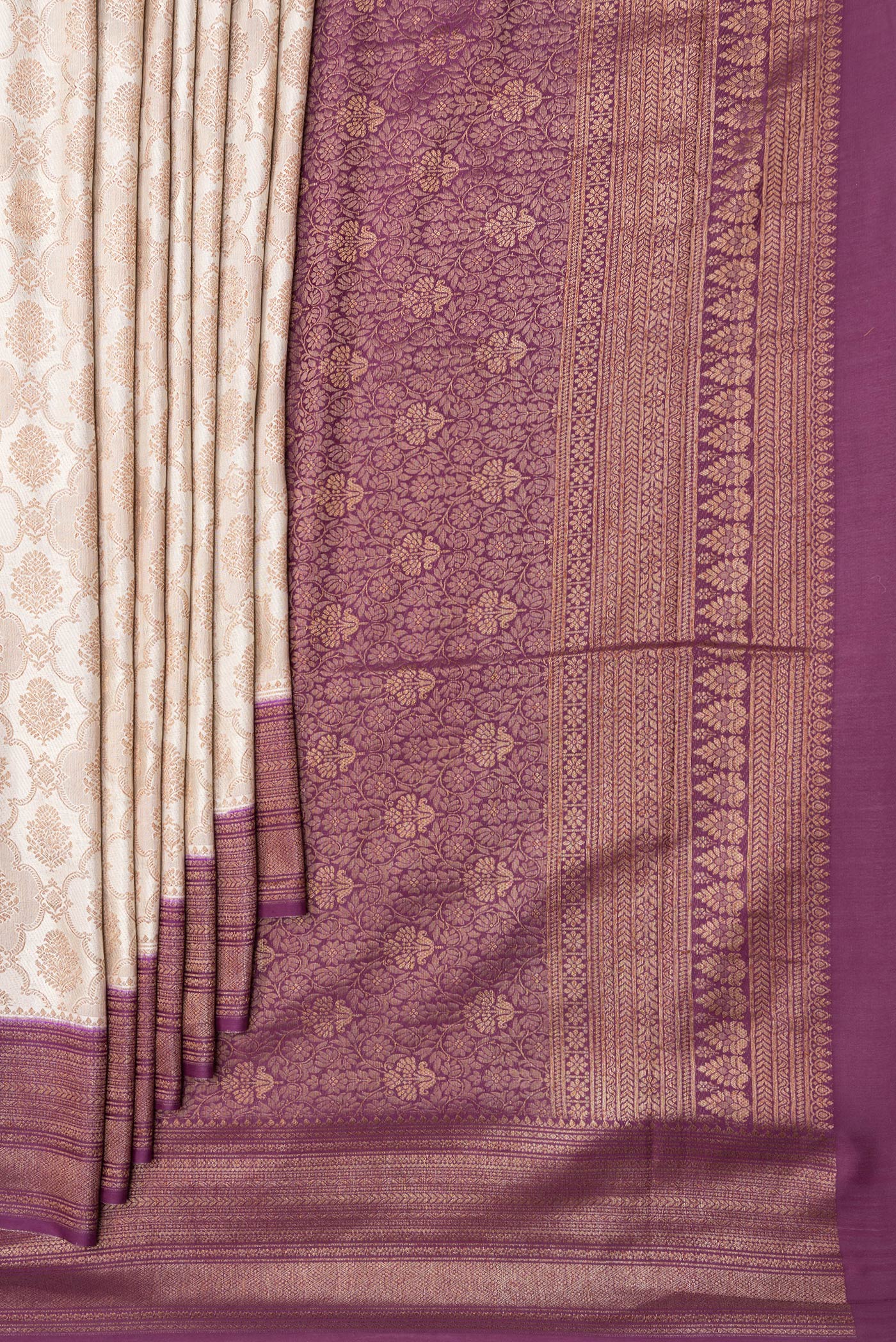 Pleats and pallu of Beige Dual Tone Banarasi Georgette Saree with Zari Brocade on the body and Zari Border. 