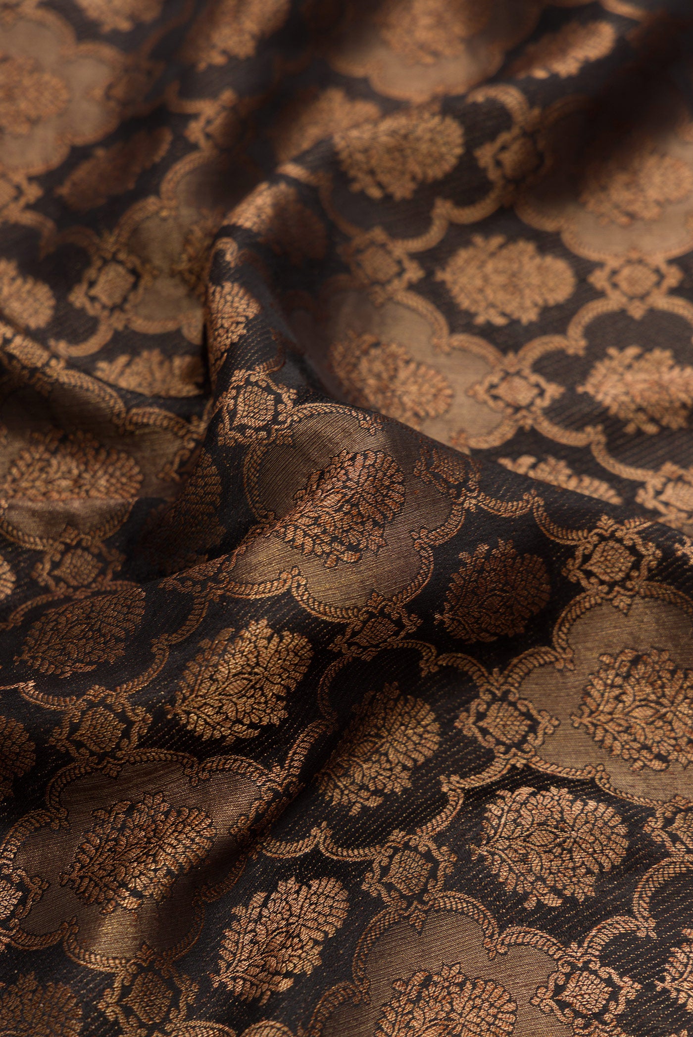 Close up of Black Dual Tone Mysore Crepe Saree with Zari Brocade on the body and Zari Border.  displaying folds