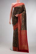 Black Dual Tone Mysore Crepe Saree with Zari Brocade on the body and Zari Border.  displayed on a mannequin