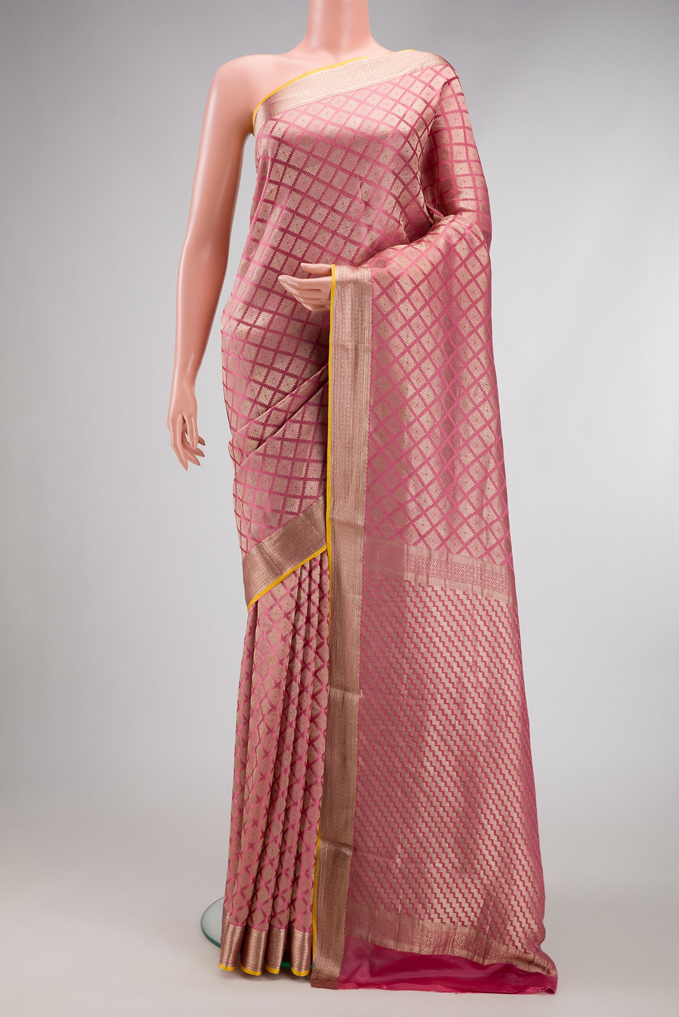 Pink Dual Tone Mysore Crepe Saree with Zari Brocade on the body and Zari Border.  displayed on a mannequin