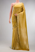Mustard Dual Tone Mysore Crepe Saree with Zari Brocade on the body and Zari Border.  displayed on a mannequin