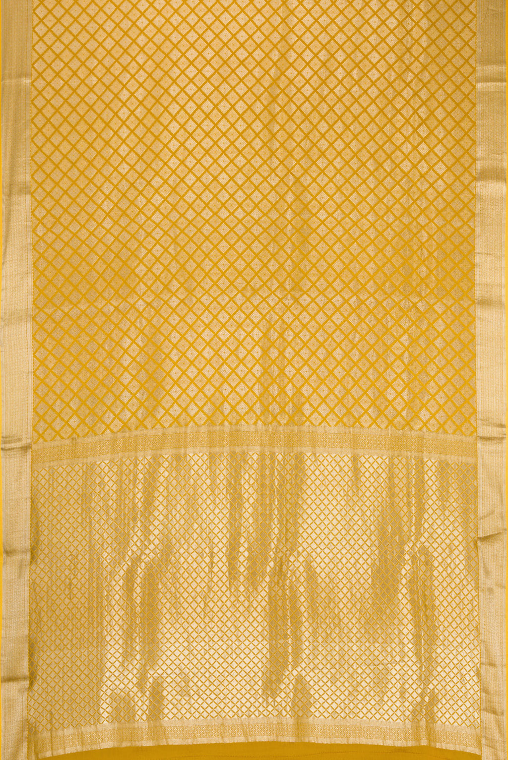 Flat view of Mustard Dual Tone Mysore Crepe Saree with Zari Brocade on the body and Zari Border. 