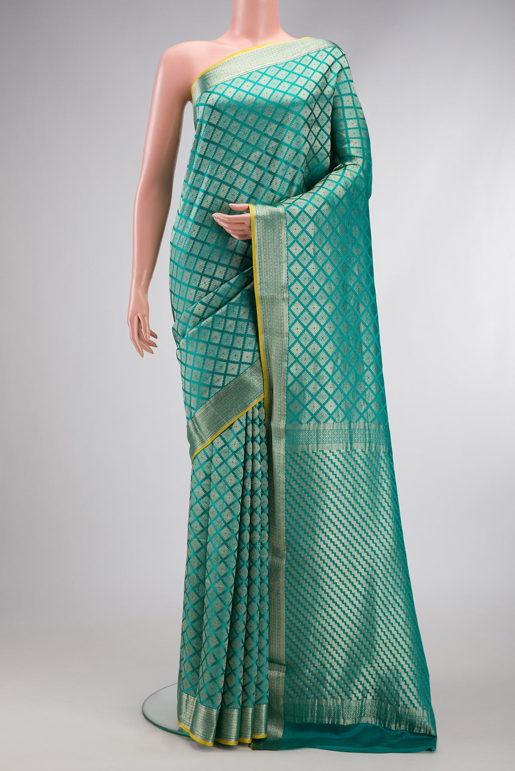Sky Blue Mysore Crepe Saree with Zari Brocade on the body and Zari Border.  displayed on a mannequin