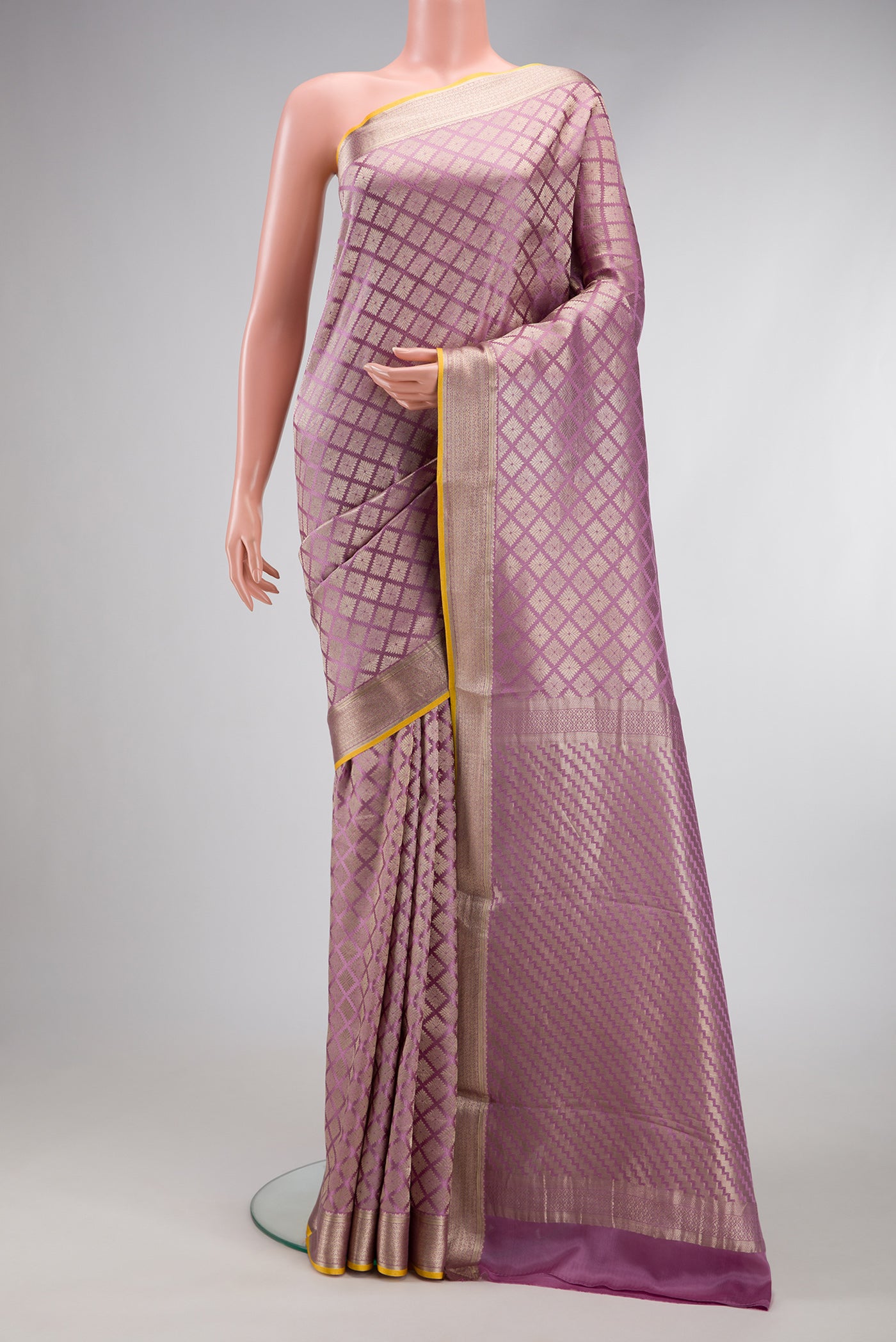 Lavender Dual Tone Mysore Crepe Saree with Zari Brocade on the body and Zari Border.  displayed on a mannequin
