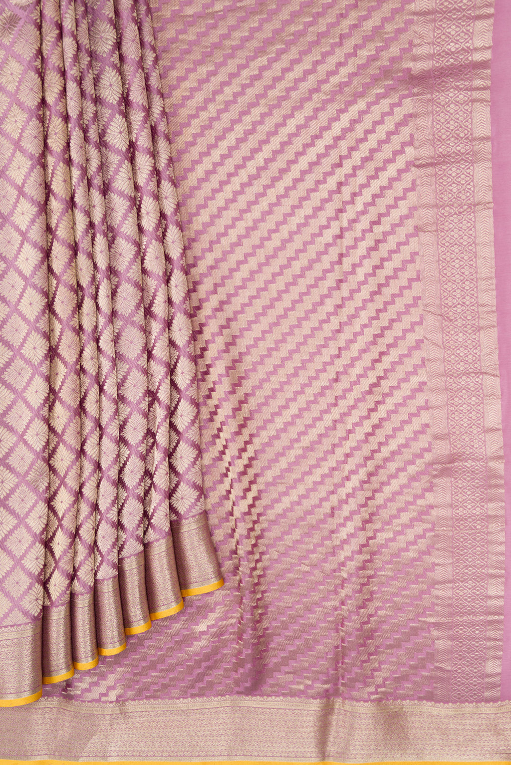 Pleats and pallu of Lavender Dual Tone Mysore Crepe Saree with Zari Brocade on the body and Zari Border. 
