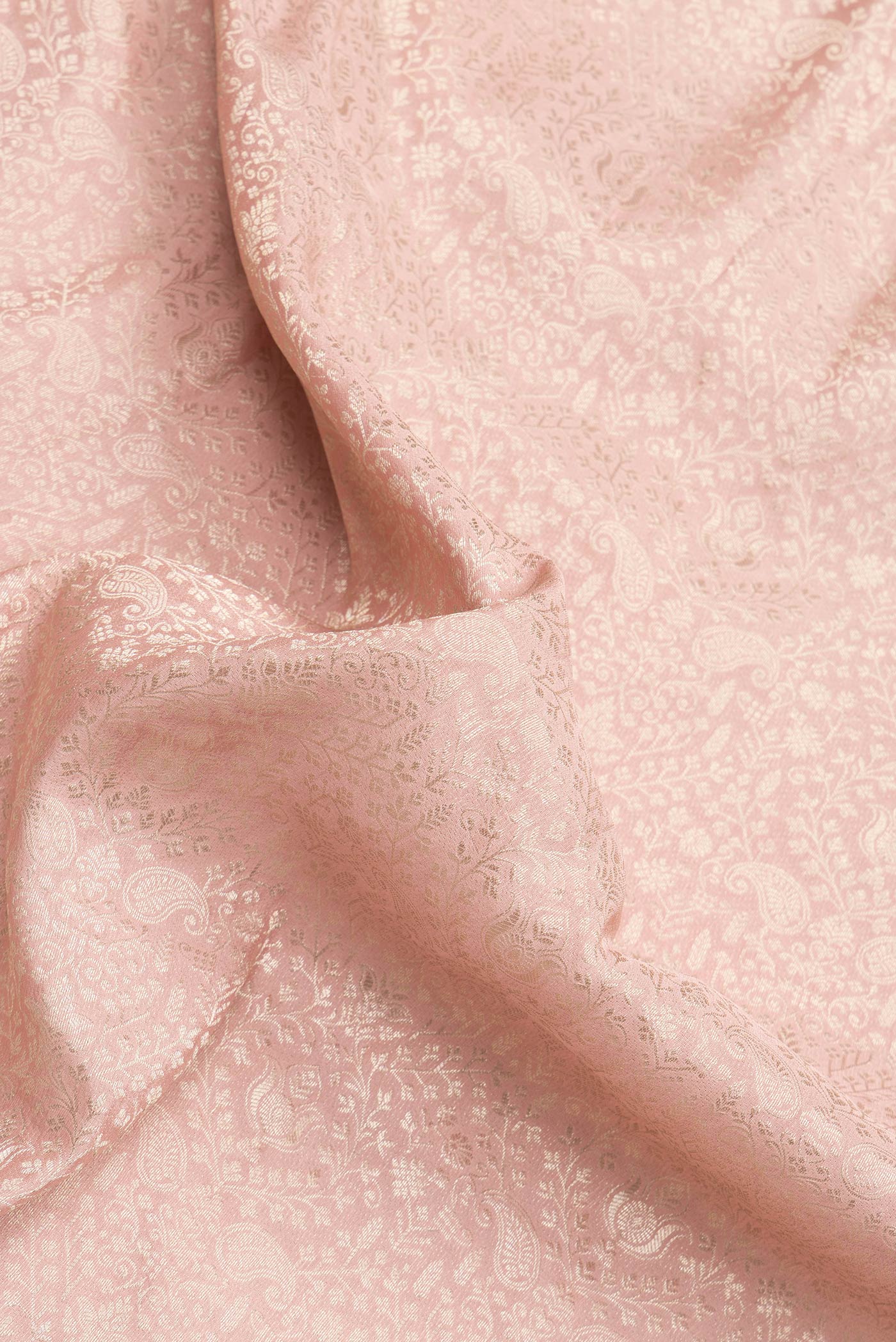 Close up of Golden Peach Dual Tone Banarasi Georgette Saree with Zari Brocade on the body and Zari Border.  displaying folds