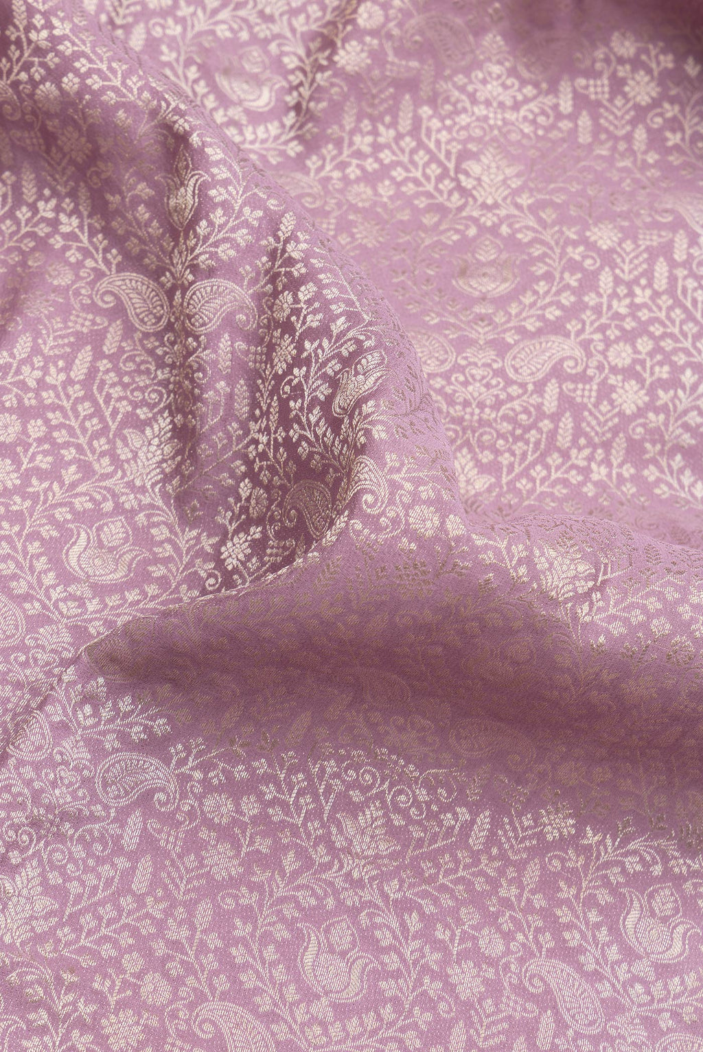 Close up of Lavender Dual Tone Banarasi Georgette Saree with Zari Brocade on the body and Zari Border.  displaying folds