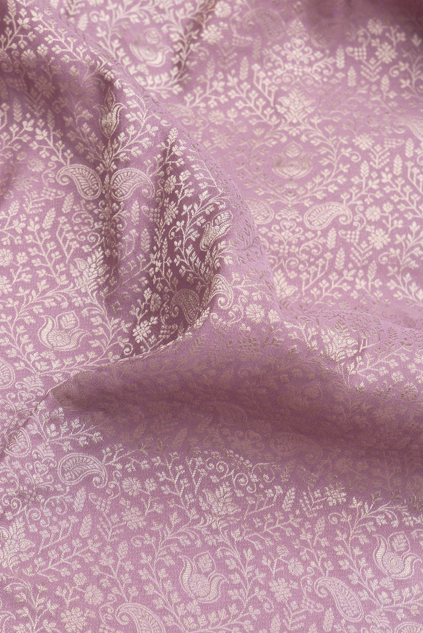 Close up of Lavender Dual Tone Banarasi Georgette Saree with Zari Brocade on the body and Zari Border.  displaying folds