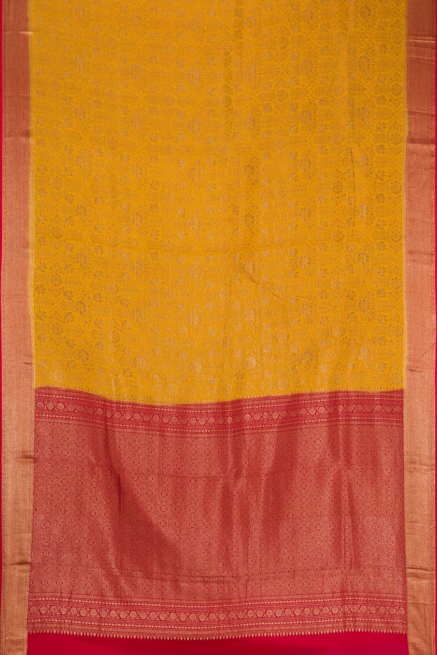 Flat view of Mustard Mysore Crepe Saree with Zari Brocade on the body and Zari Border. 