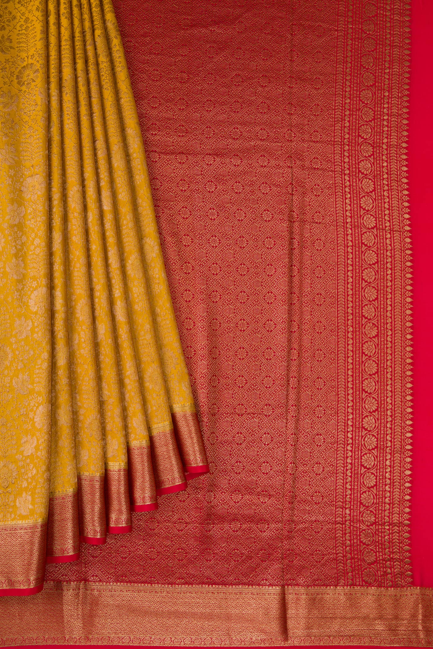 Pleats and pallu of Mustard Mysore Crepe Saree with Zari Brocade on the body and Zari Border. 