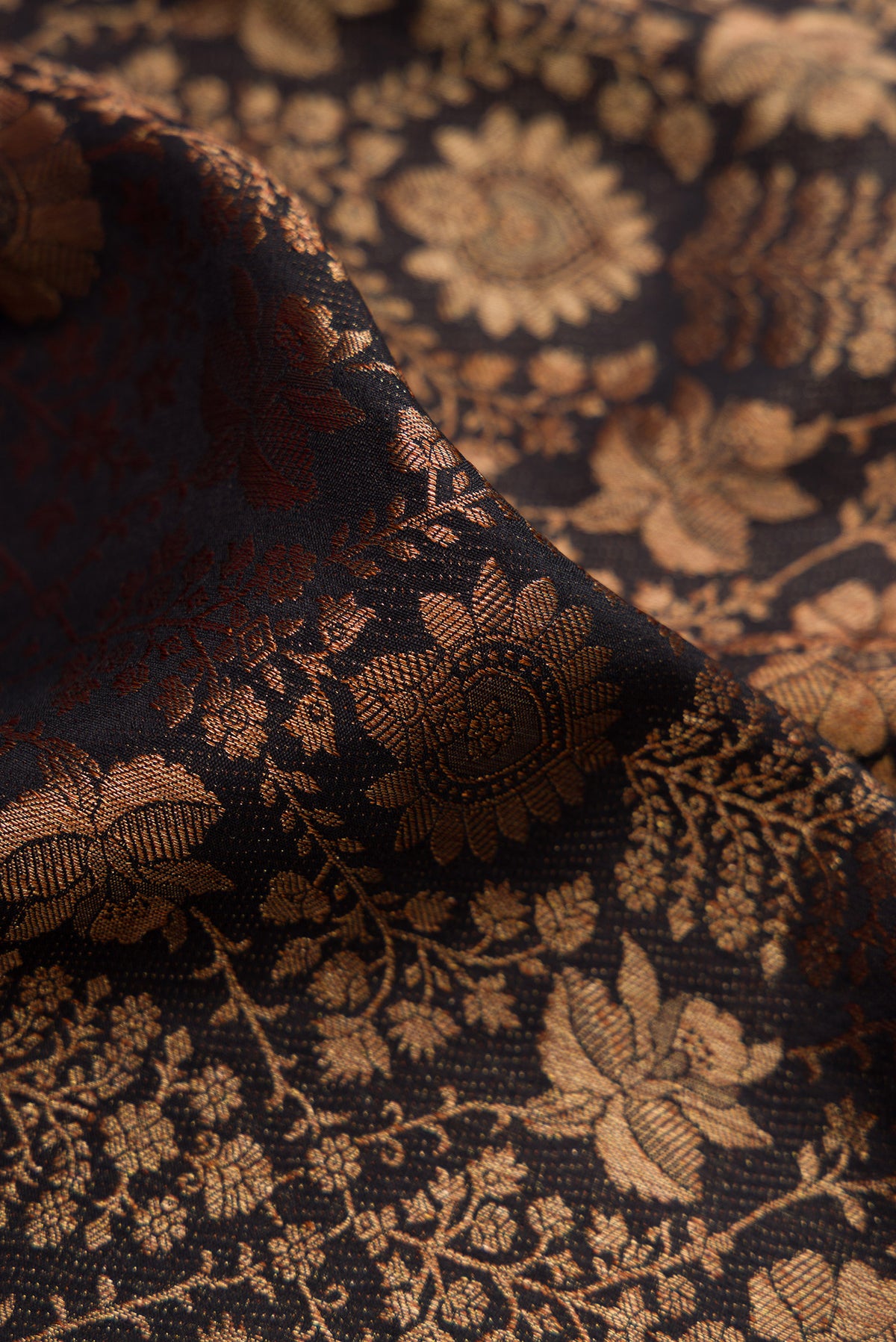 Close up of Black Mysore Crepe Saree with Zari Brocade on the body and Zari Border.  displaying folds