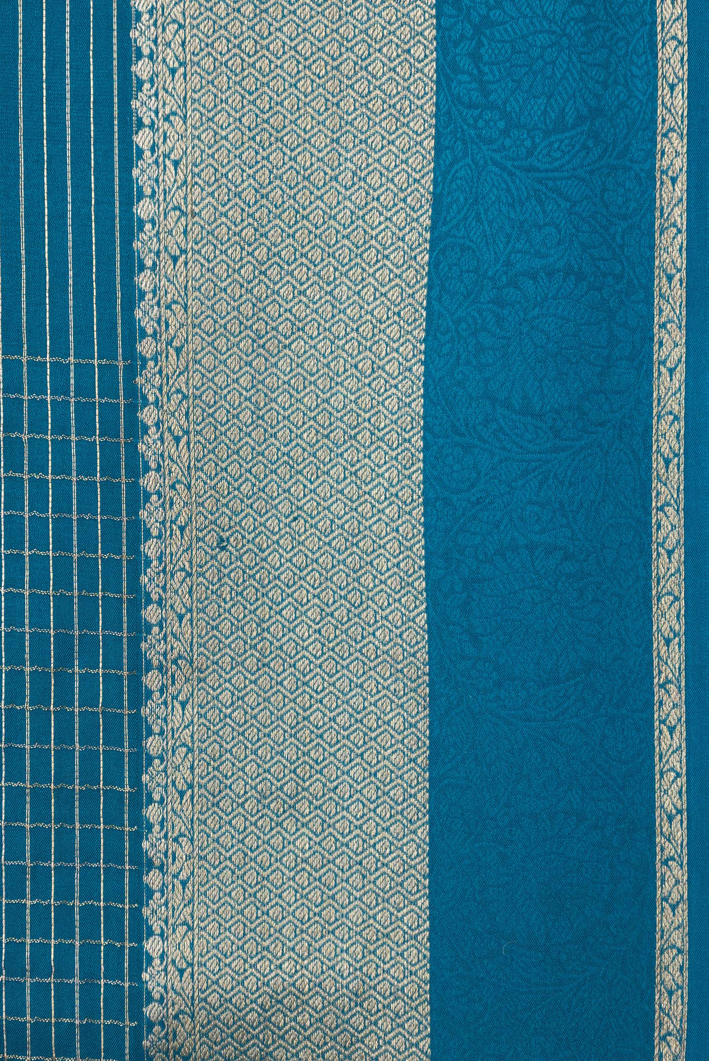Border image of Peacock Blue Dual Tone Banarasi Georgette Saree with Checked design on the body and Zari And Thread Border. 