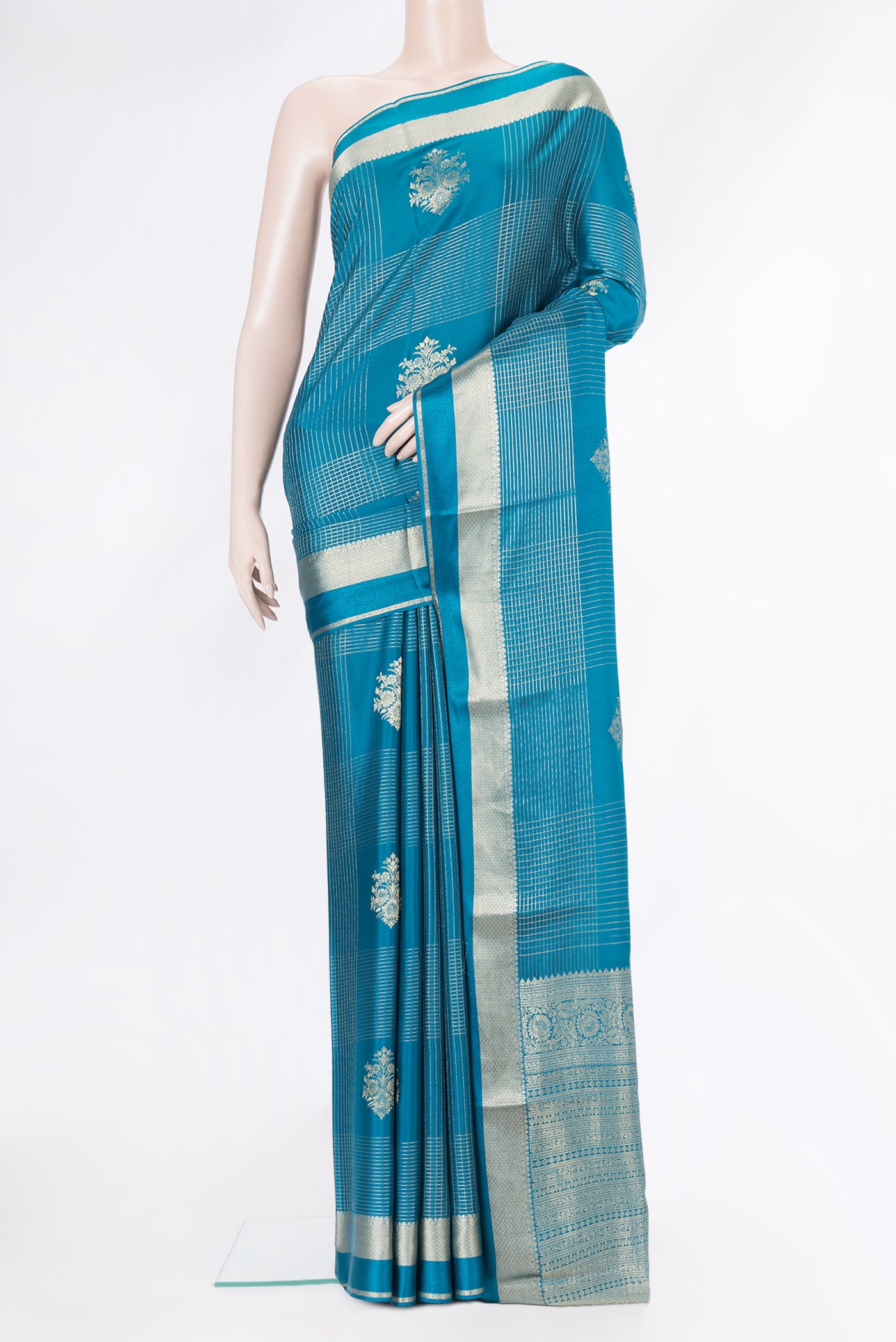 Peacock Blue Dual Tone Banarasi Georgette Saree with Checked design on the body and Zari And Thread Border.  displayed on a mannequin