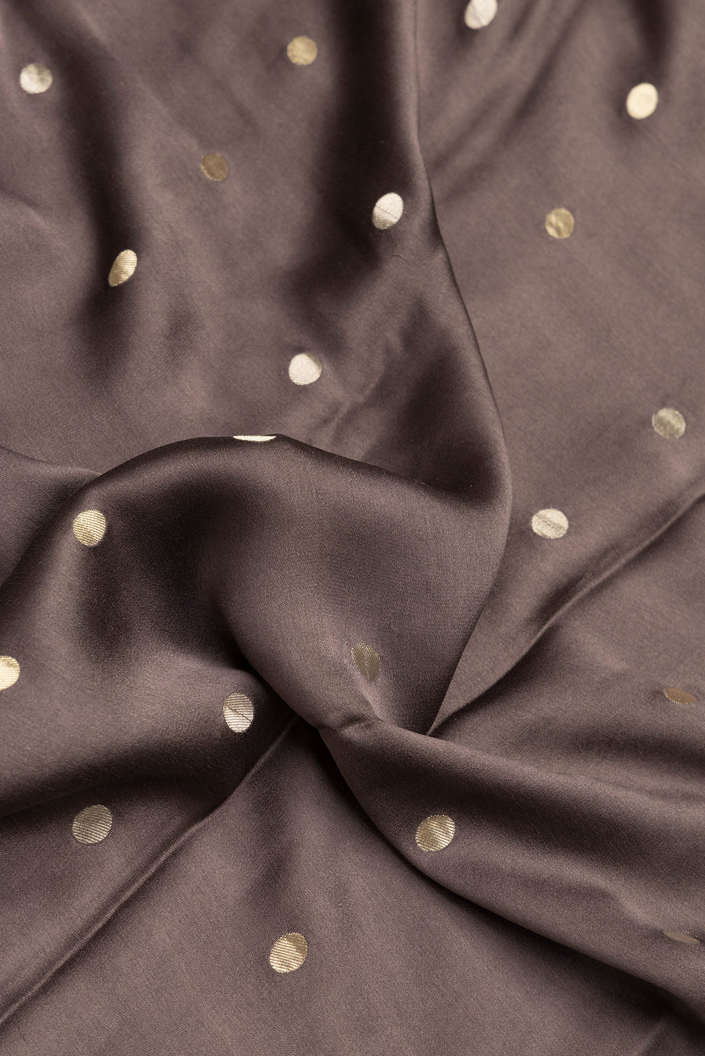 Close up of Brown Dual Tone Mysore Silk Saree with Zari Butta on the body and Zari Border.  displaying folds