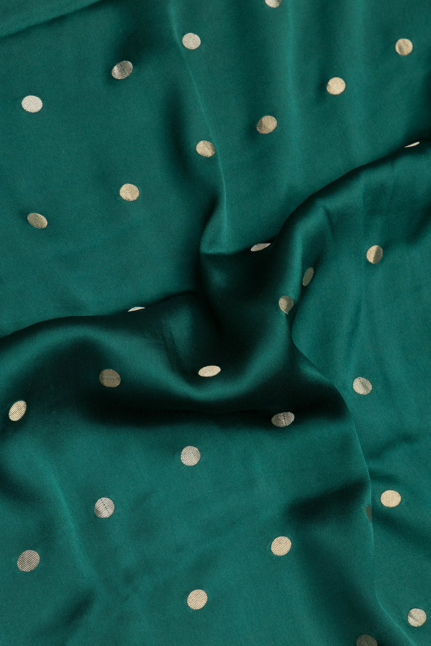 Close up of Bottle Green Dual Tone Mysore Silk Saree with Zari Butta on the body and Zari Border.  displaying folds