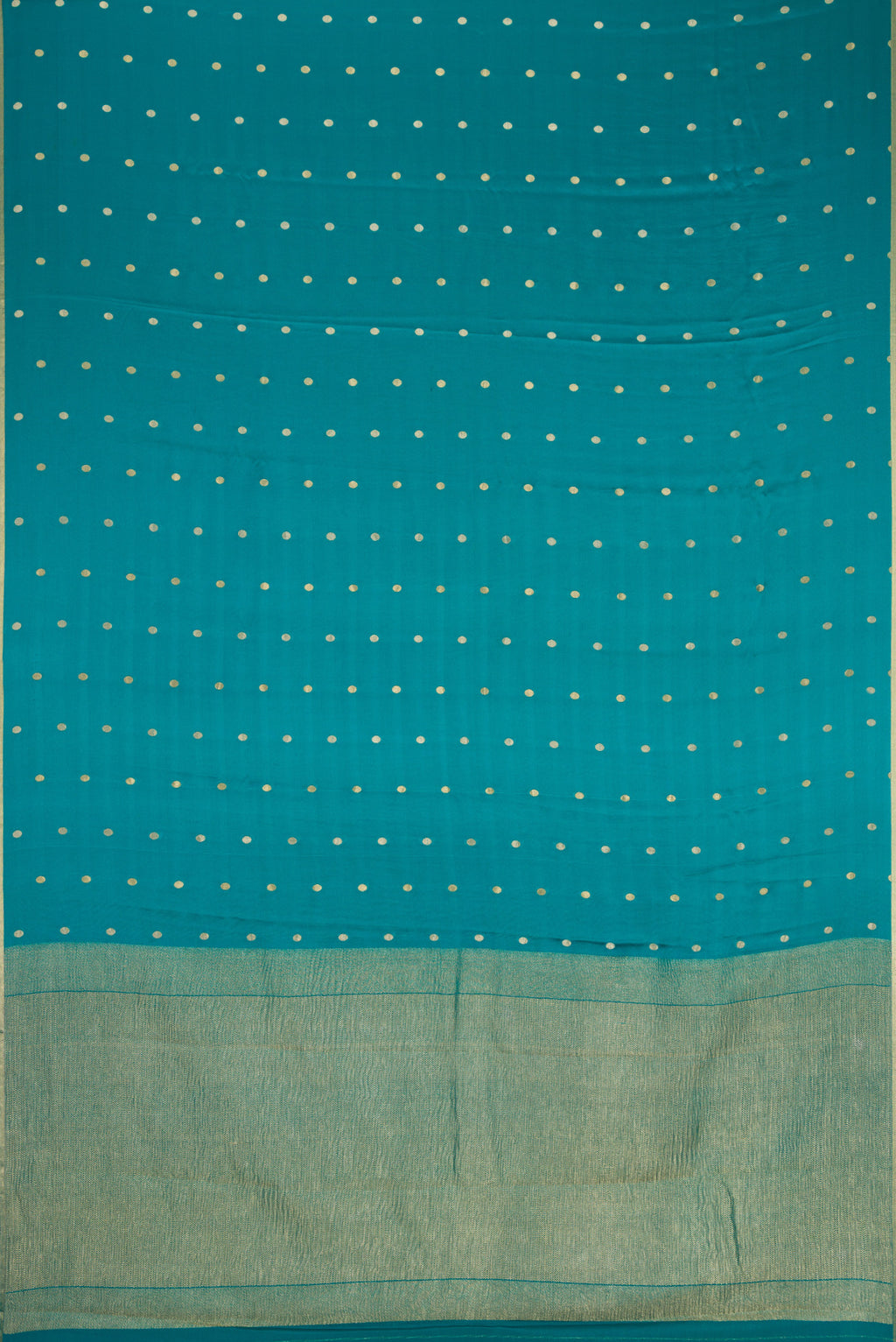 Flat view of Peacock Blue Mysore Chiffon Saree with Zari Butta on the body and Zari Border. 